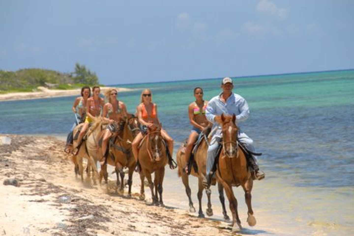things to do in cayman islands | trek along the shore on horseback