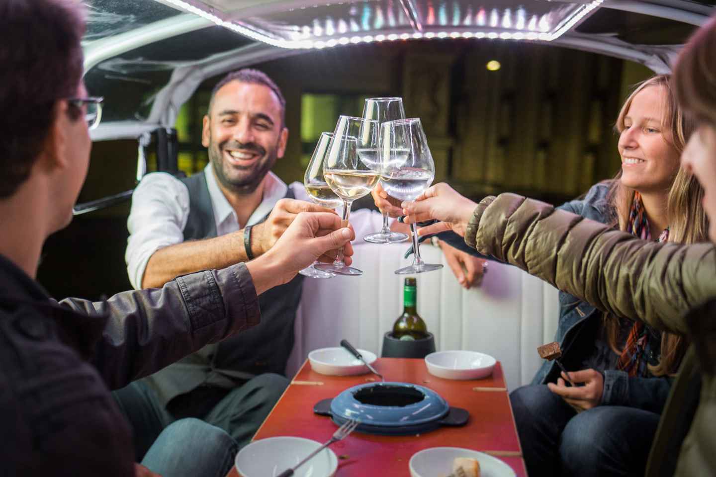 things to do in zurich at night | enjoy a fantastic swiss fondue in a tuk-tuk sightseeing tour