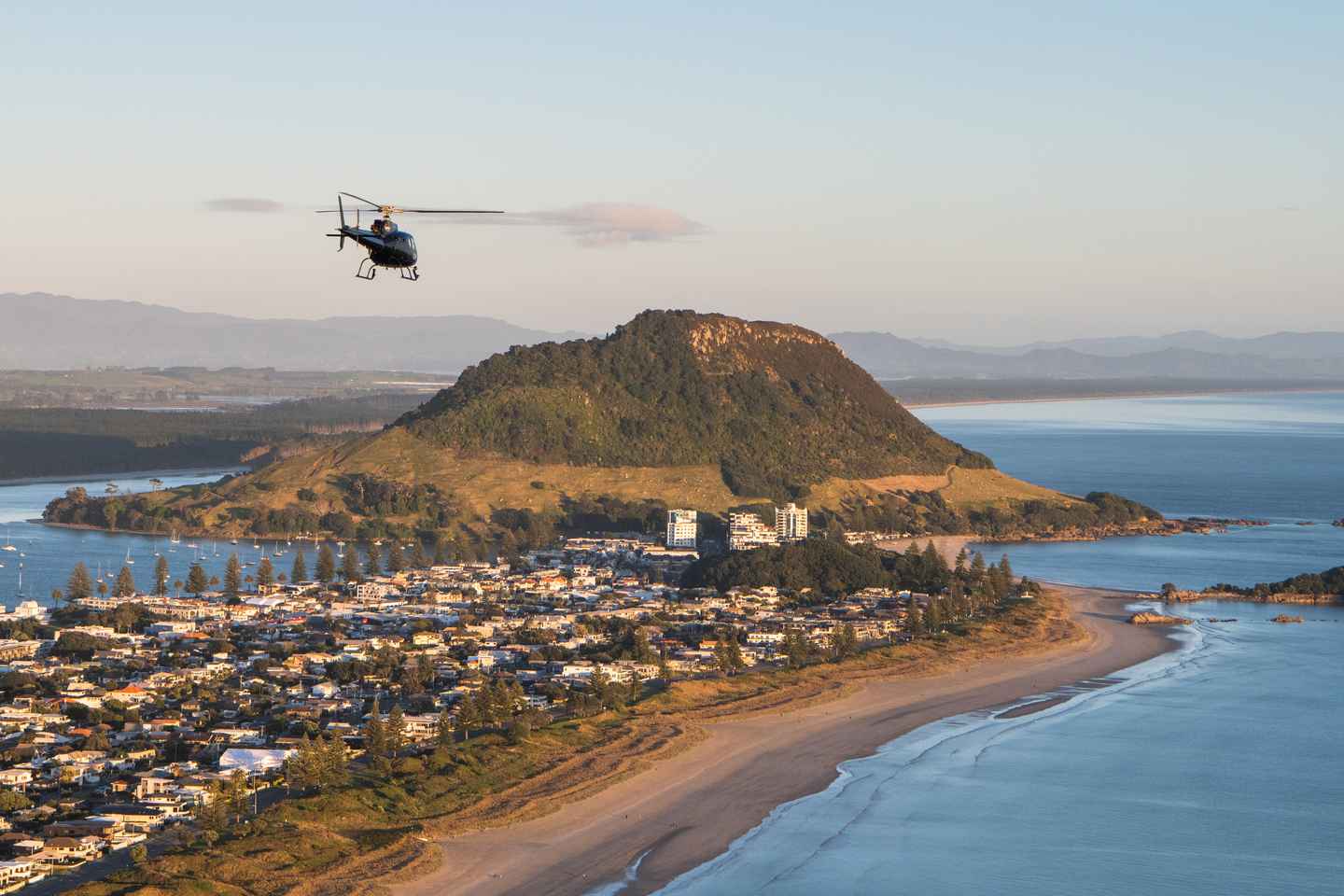 things to do in mount maunganui nz | explore the harbor town on a helicopter flight