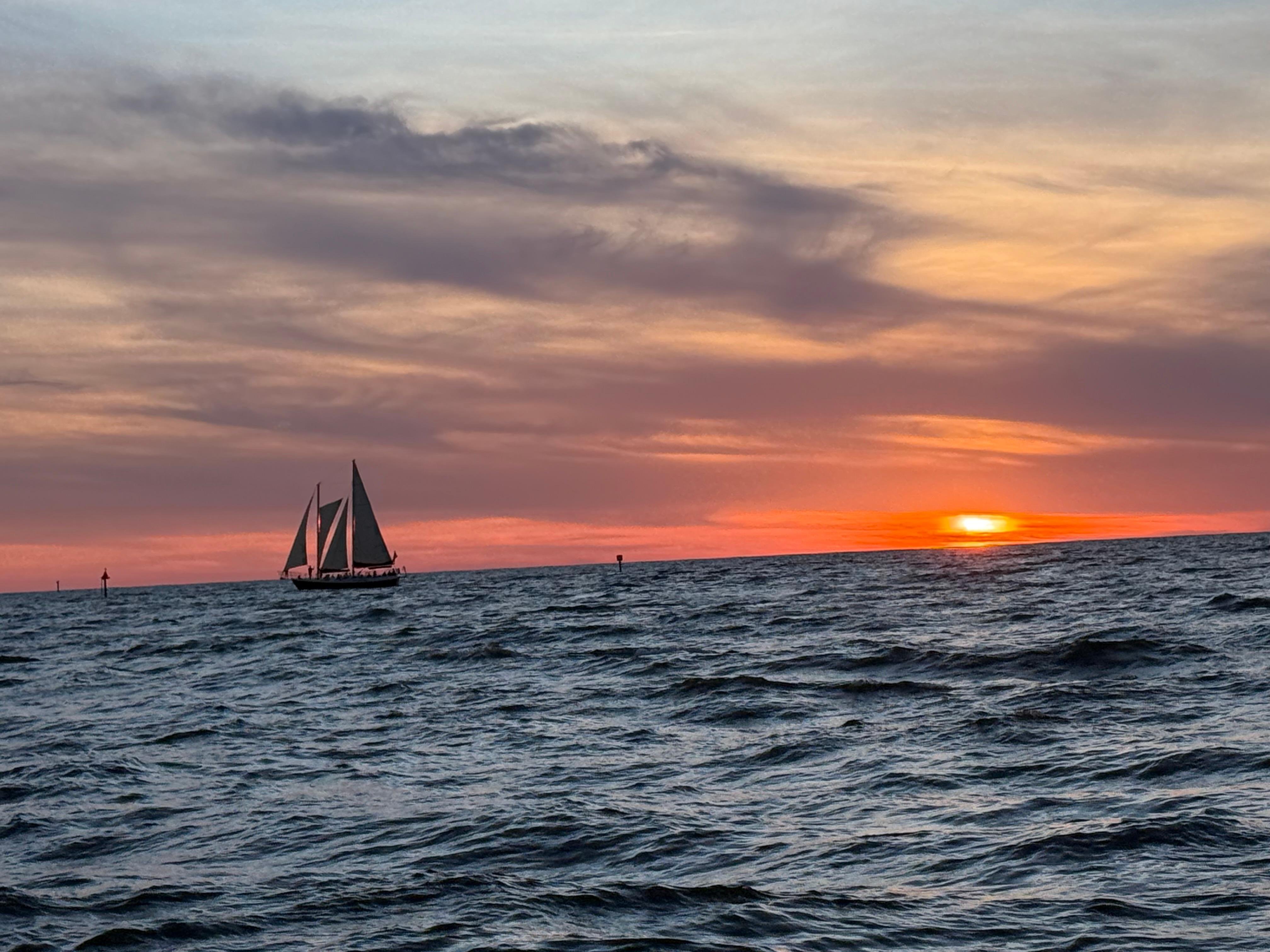 Sunset & Harbor Lights Cruise, the lead tour returning across calm water