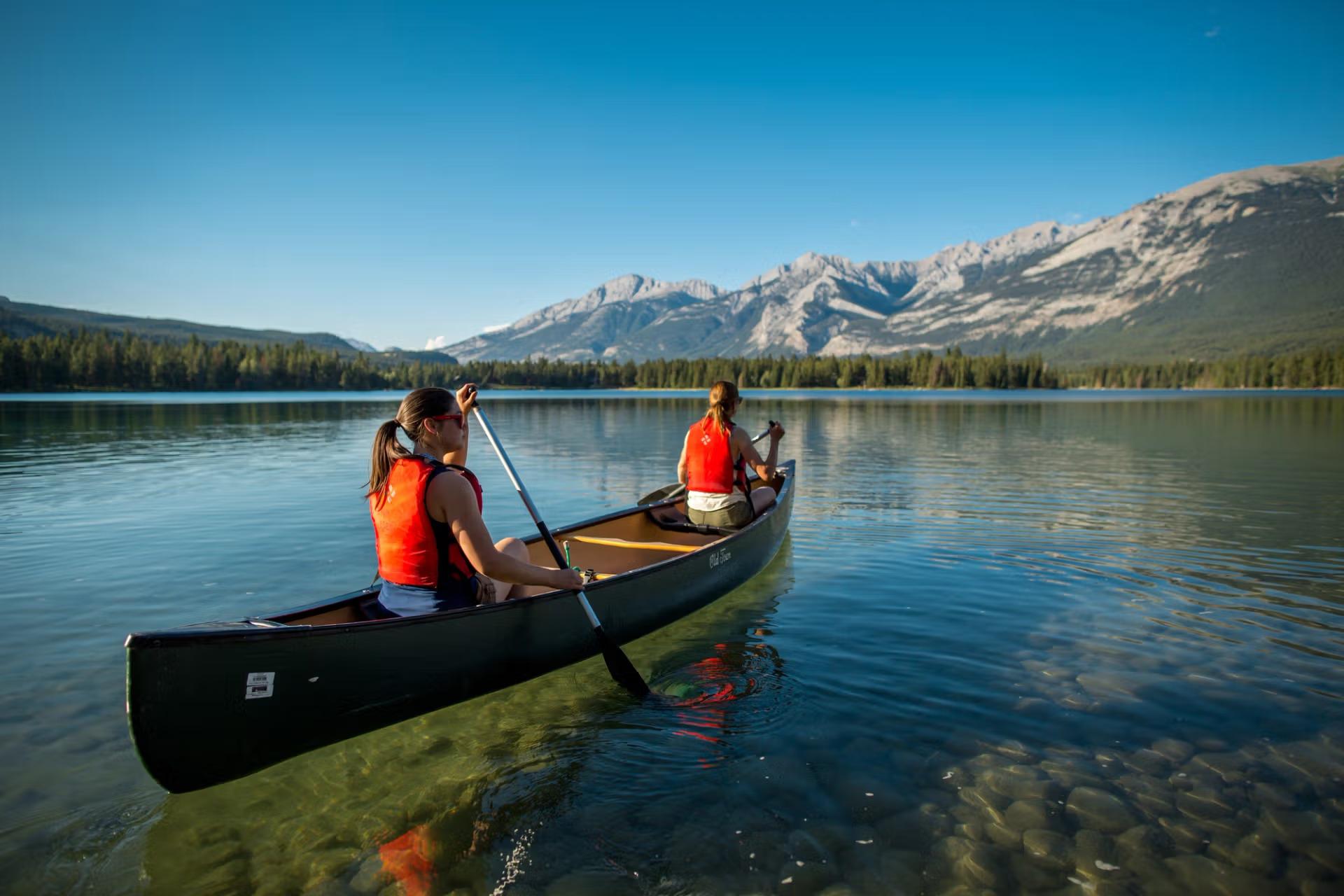 Lake Louise red canoe turquoise glacial water Victoria Glacier Banff National Park — image 6