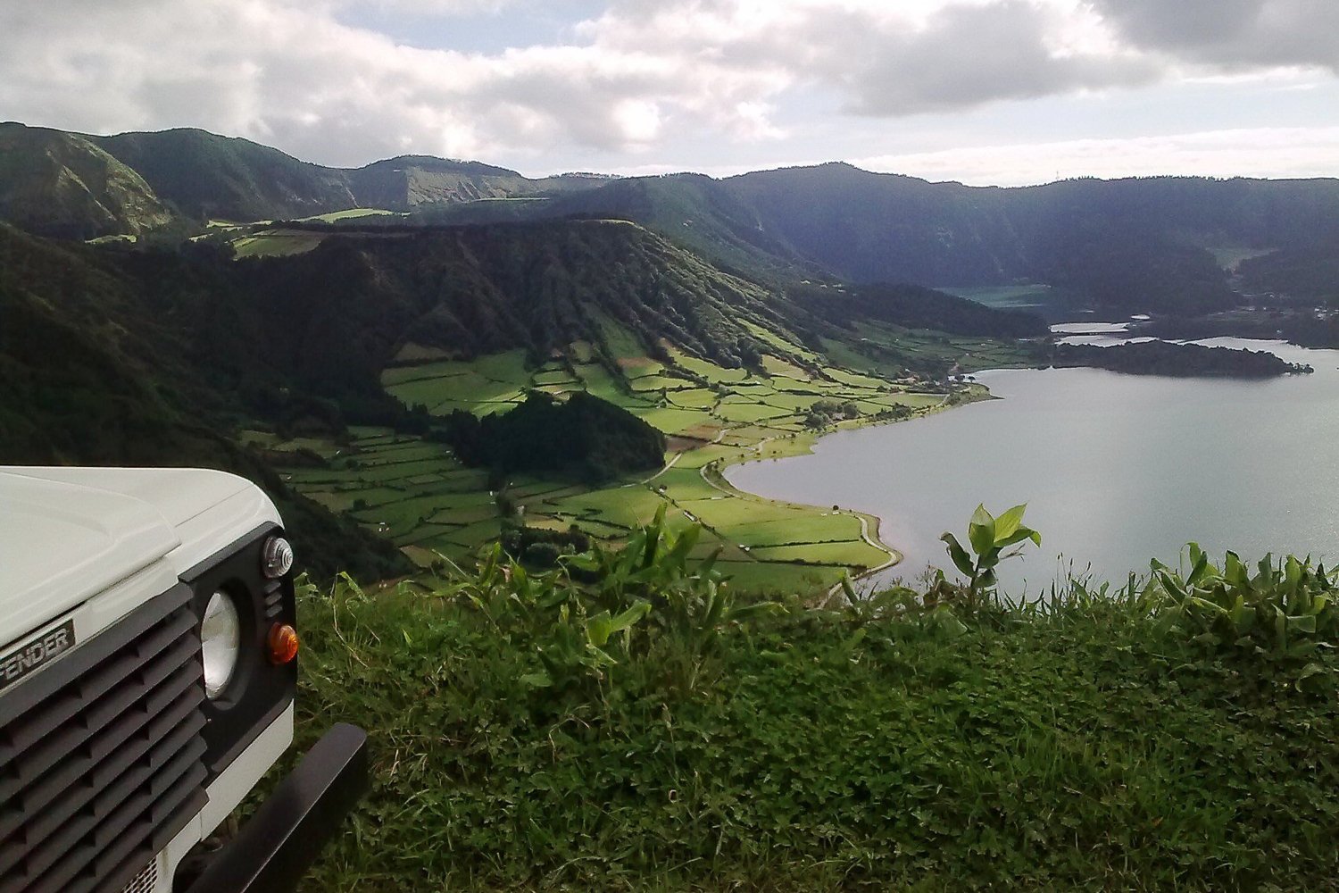 Jeep parked above the Sete Cidades lake and farmland