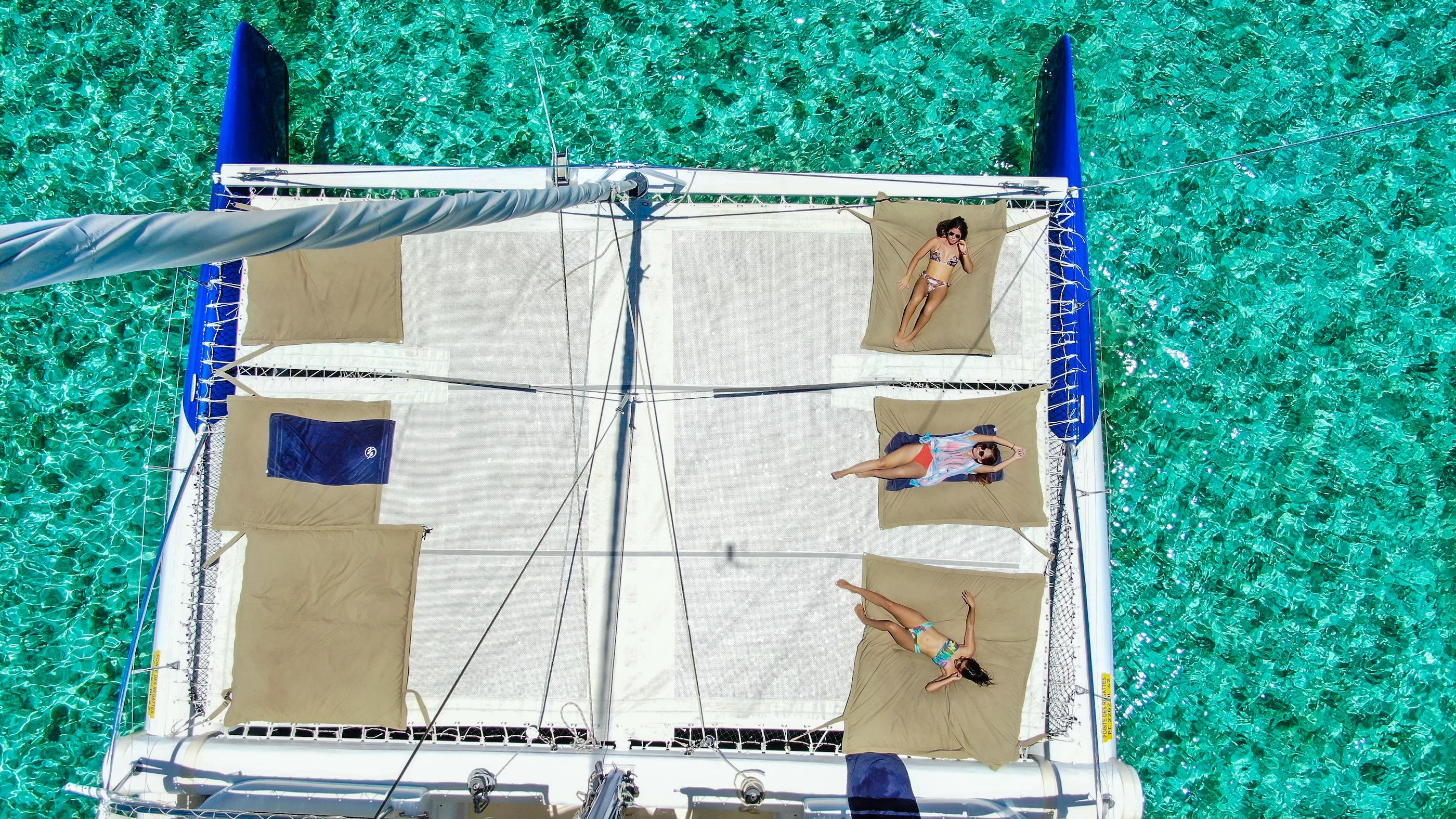 Overhead view of a catamaran and its front deck nets