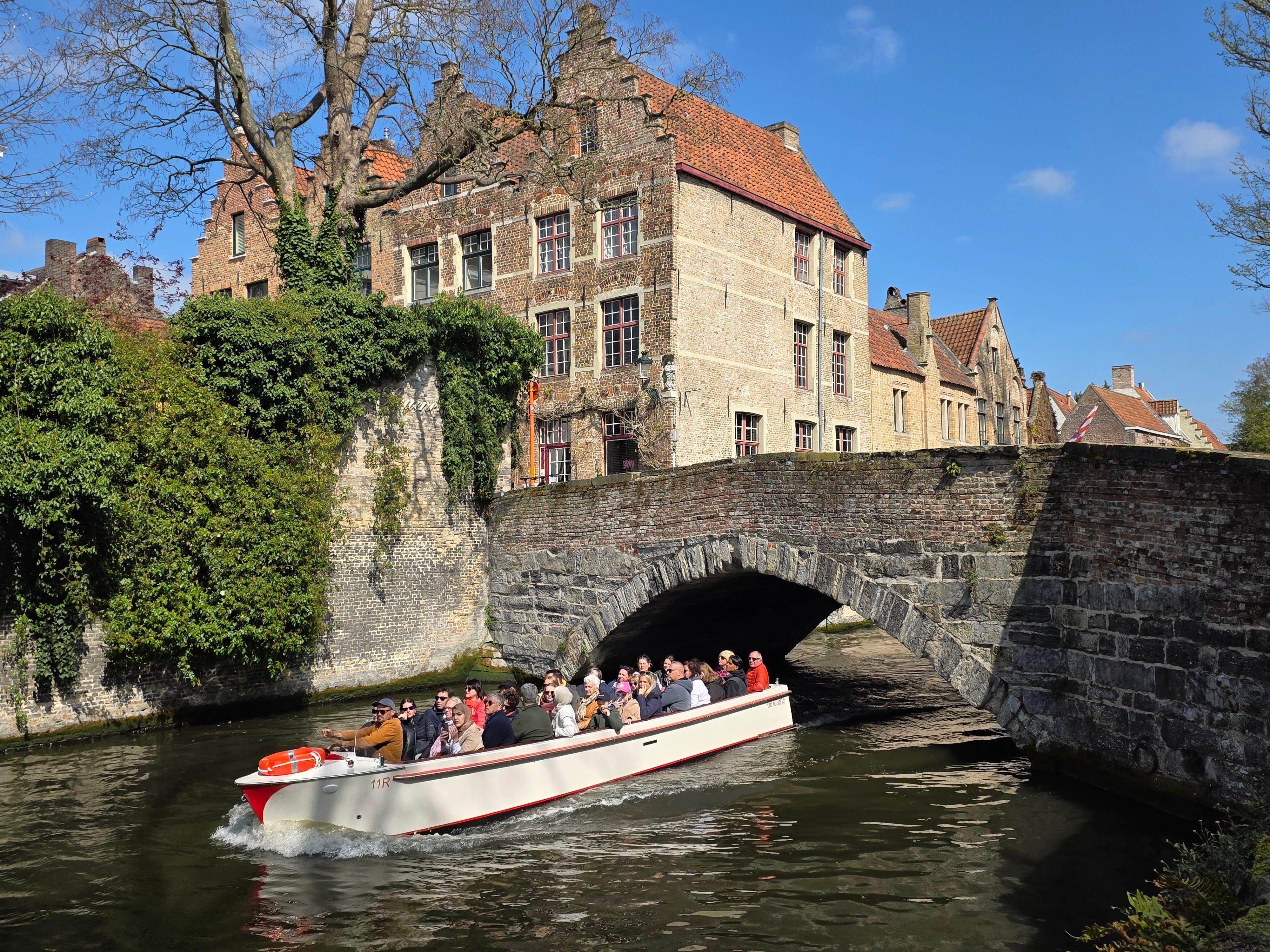 Bruges canal boat tour — medieval canals, low bridges, the Belfry and the Beguinage in the Venice of the North — image 33
