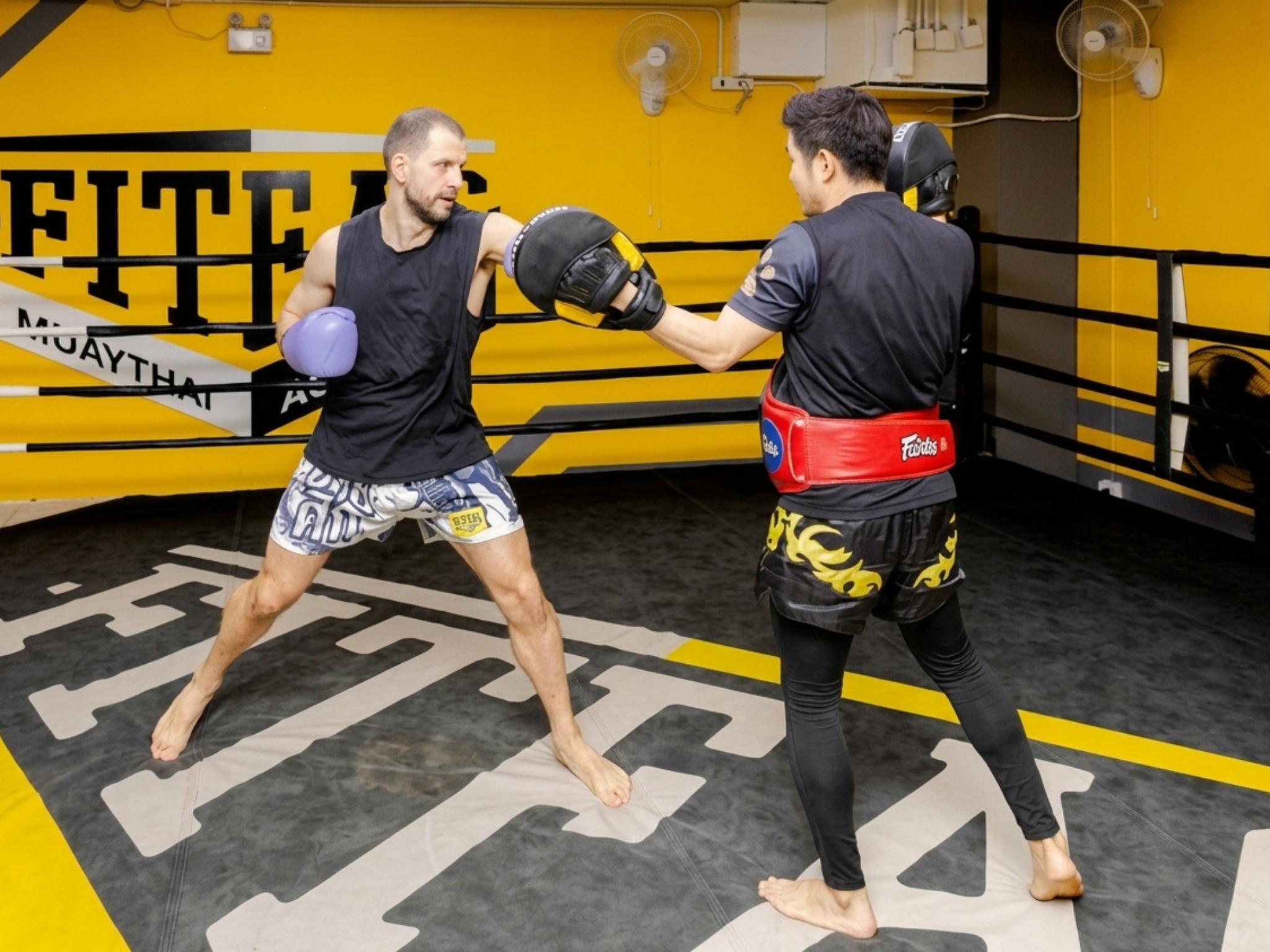 Muay Thai class in Bangkok — beginner training session with a professional trainer — image 12
