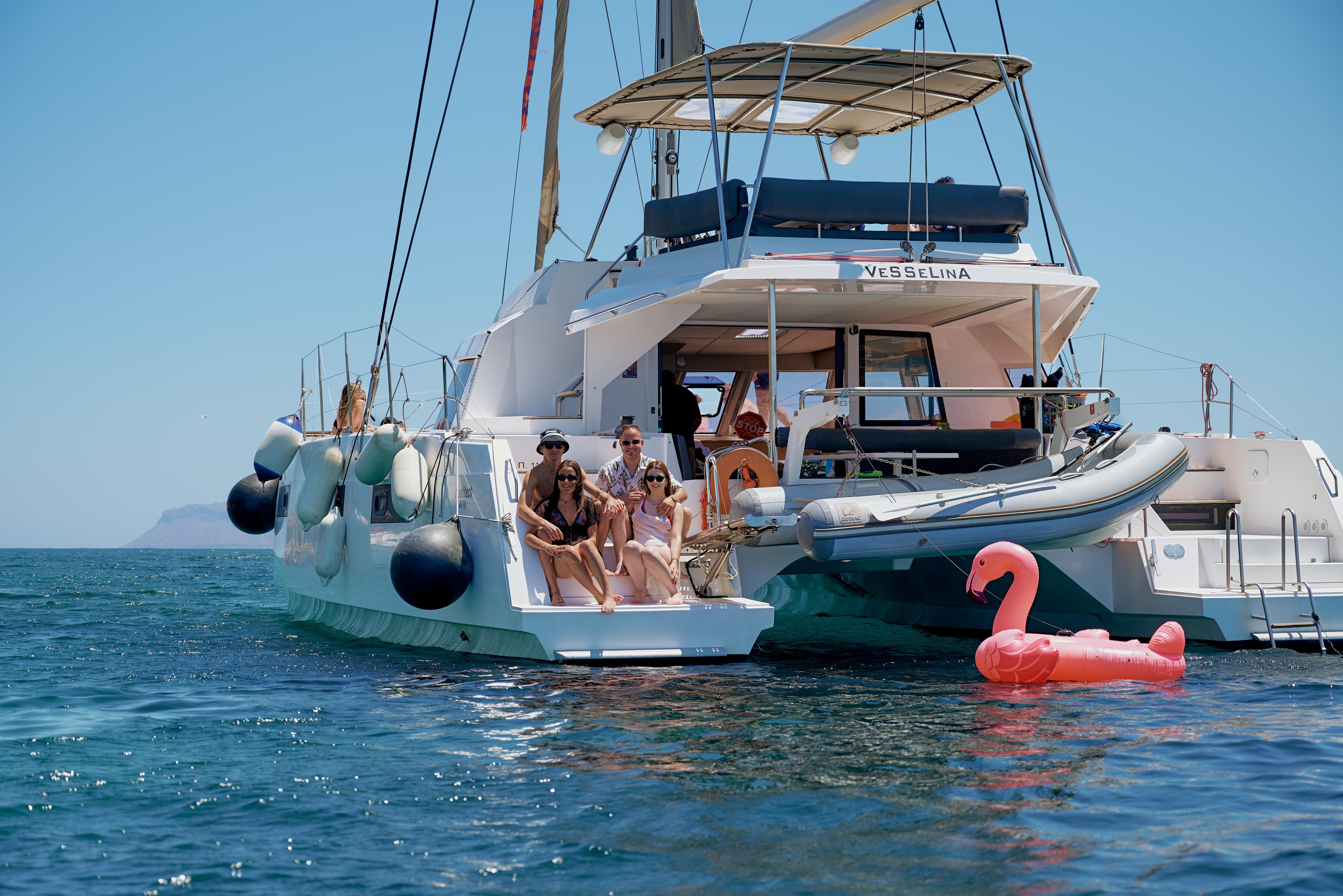 Premium Catamaran Sail to Agioi Theodoroi with Chef-Crafted Lunch