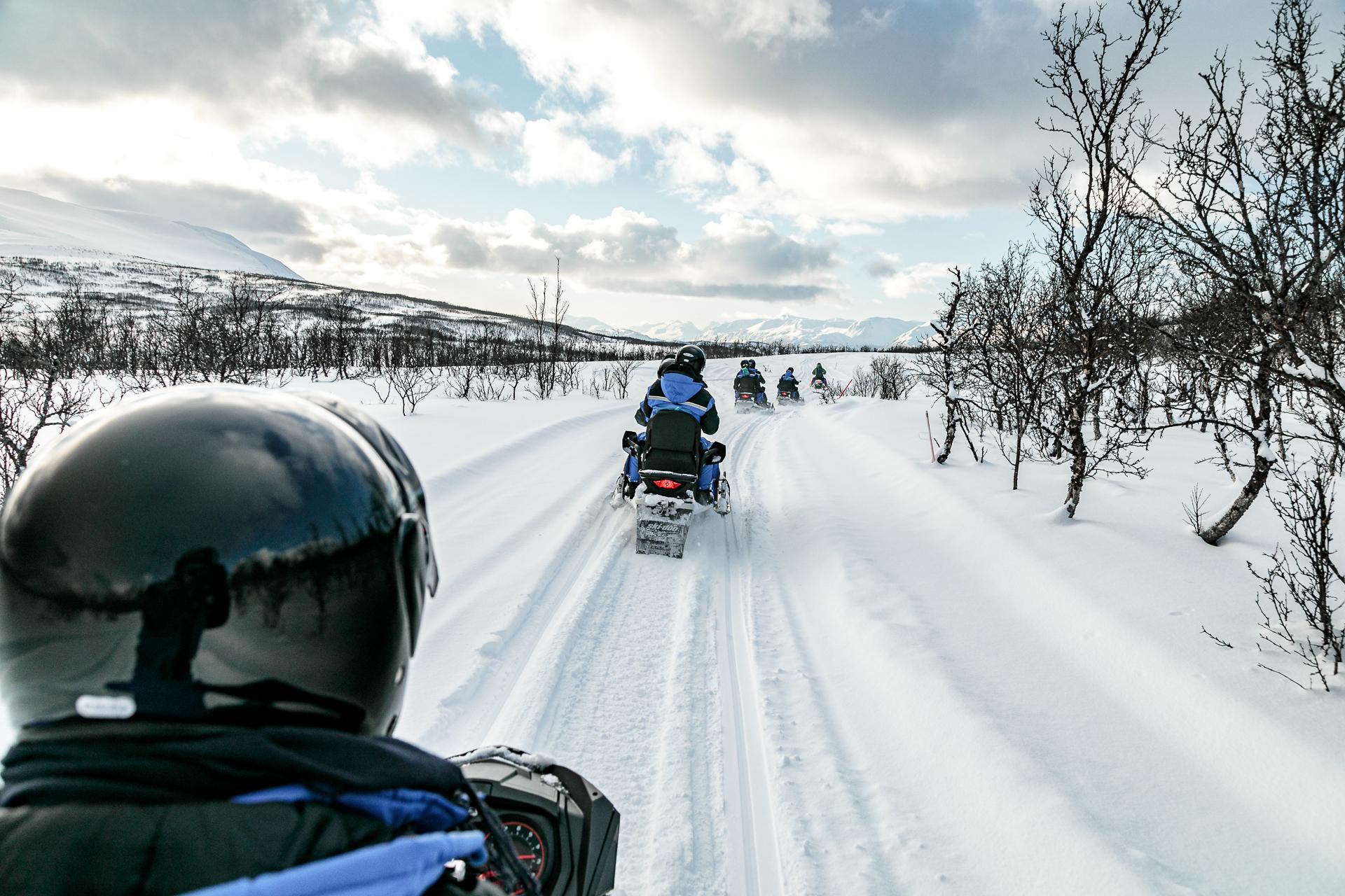 Lyngen Alps Snowmobile Safari with Seaside Lunch