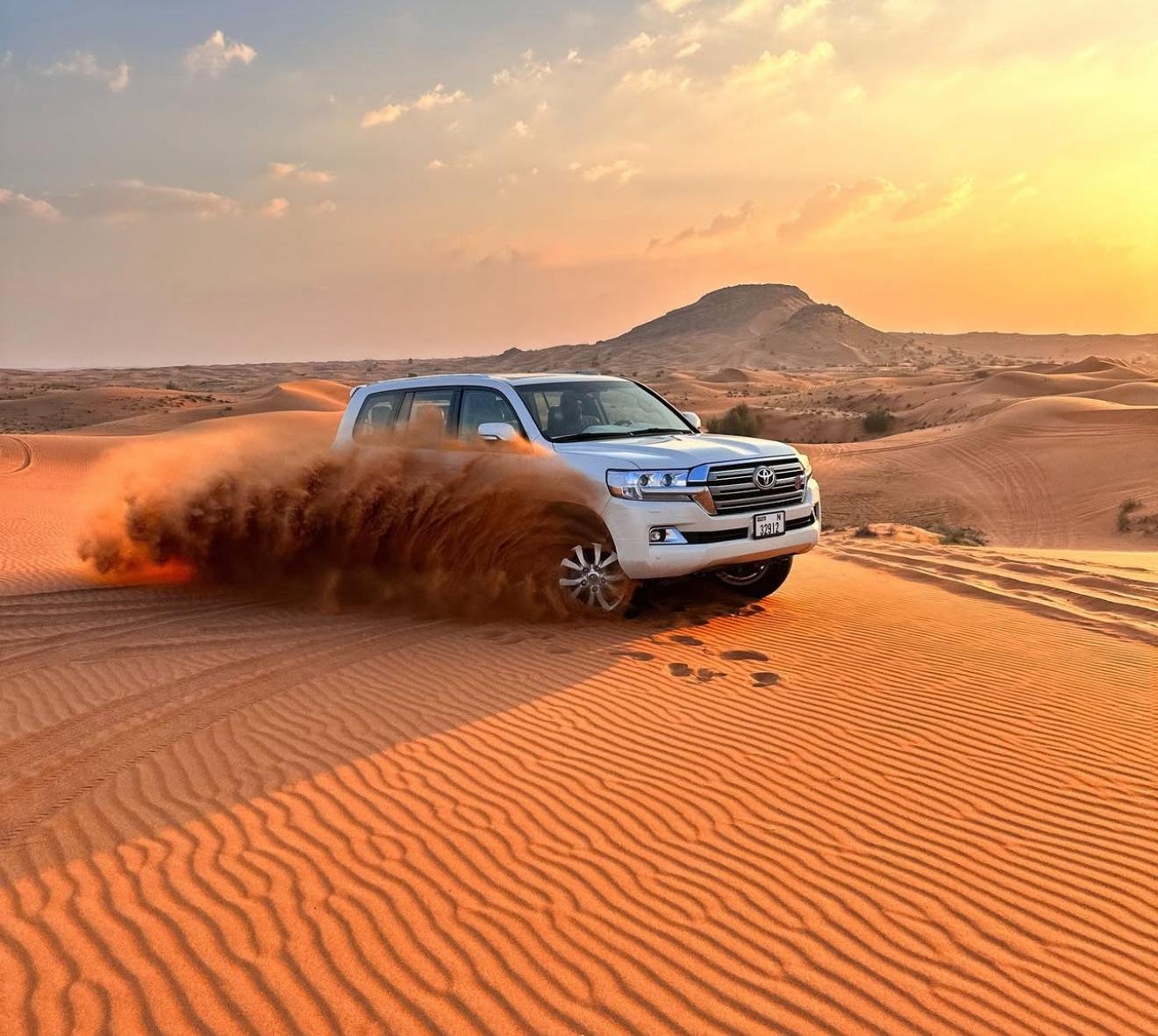 Doha Desert Safari: Sunset Dune Bashing, Camel Ride & Sandboarding