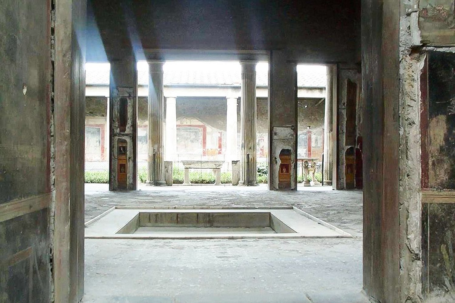 Pompeii and Vesuvius full-day tour from the Amalfi Coast - Pompeii's Forum colonnade beneath Vesuvius