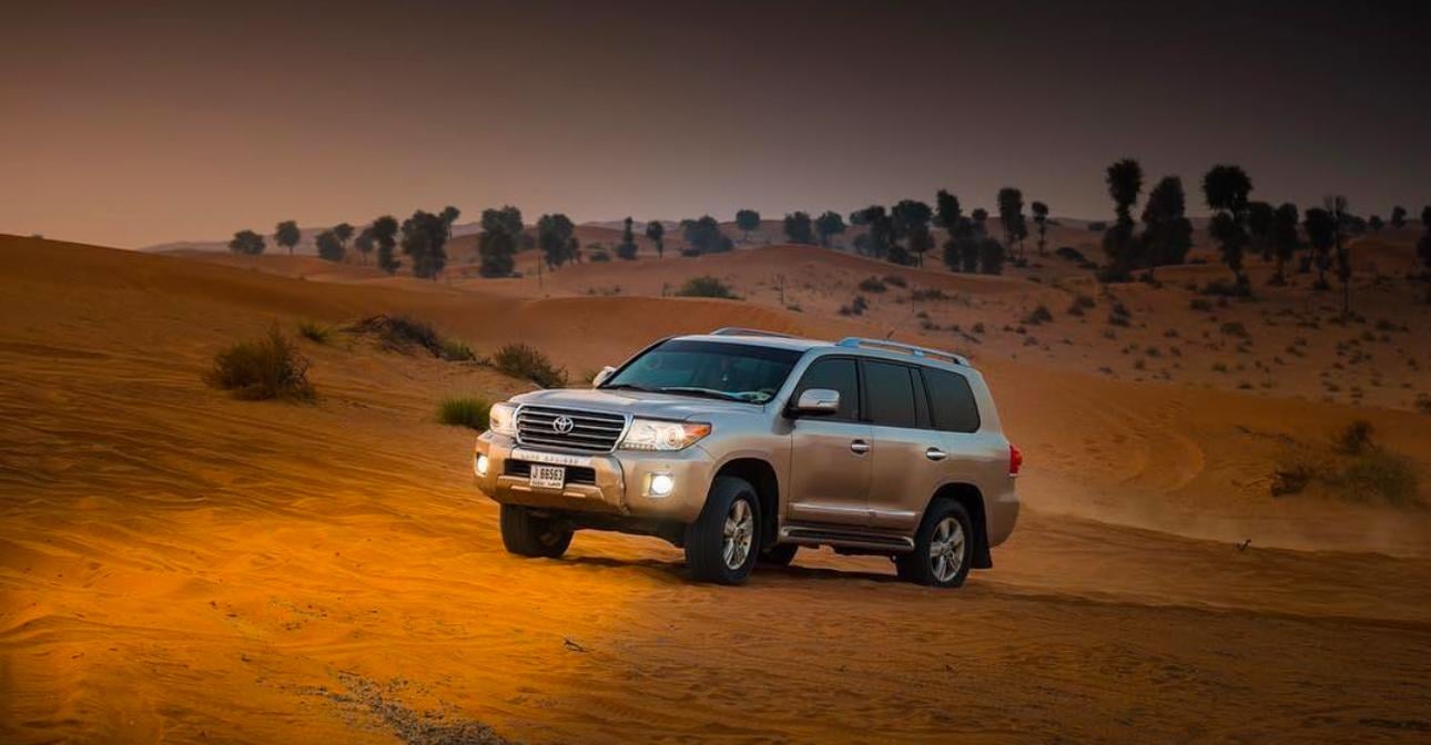 Doha Desert Safari: Sunset Dune Bashing, Camel Ride & Sandboarding
