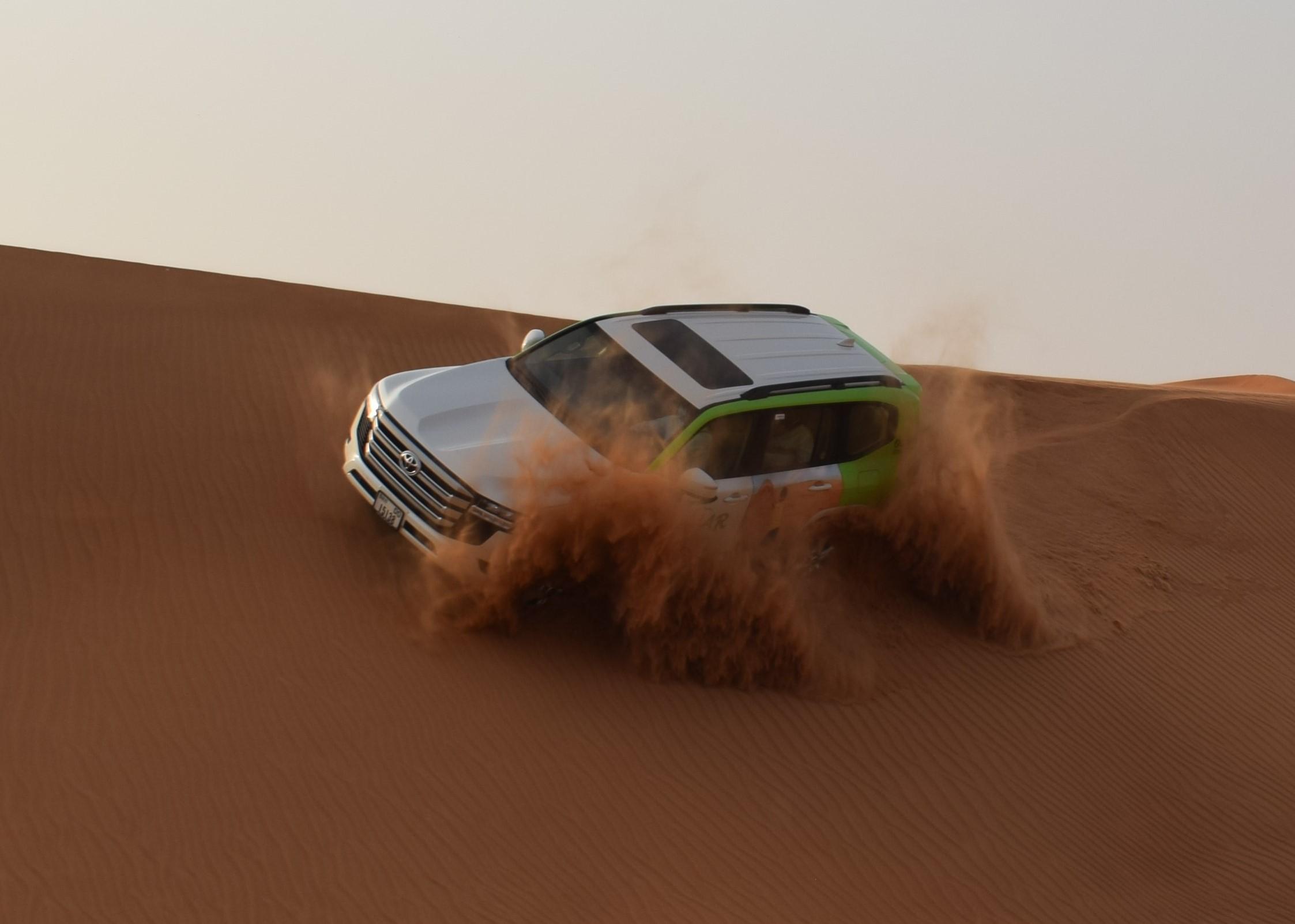 Dubai Red Dune Desert Safari with Quad Bike, Camel Ride & BBQ