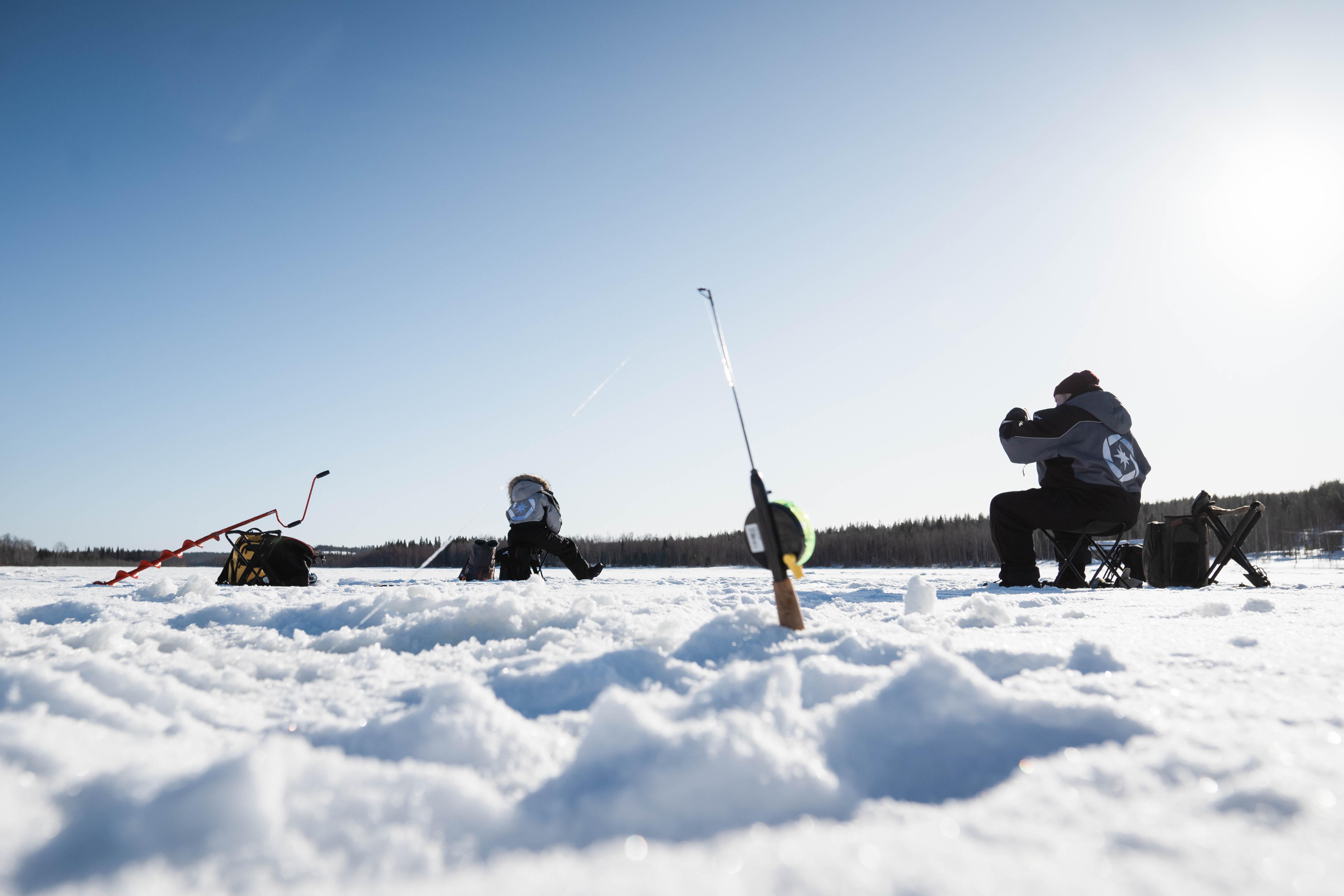 Rovaniemi Ice Fishing on a Frozen Lake with BBQ & Photos