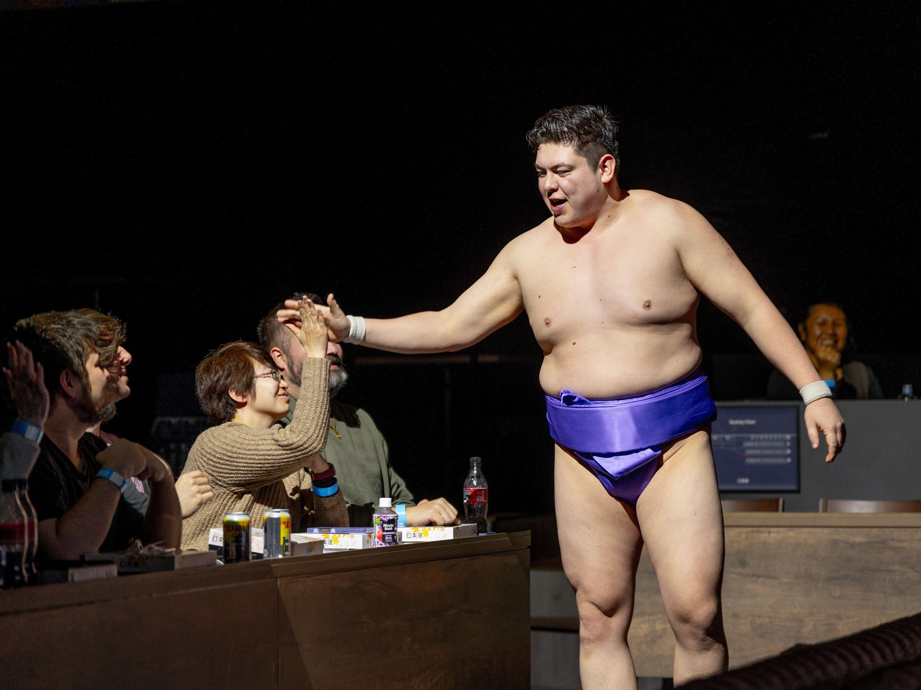 Sumo Performance and Dining Experience at Osaka's Hirakuza Hall