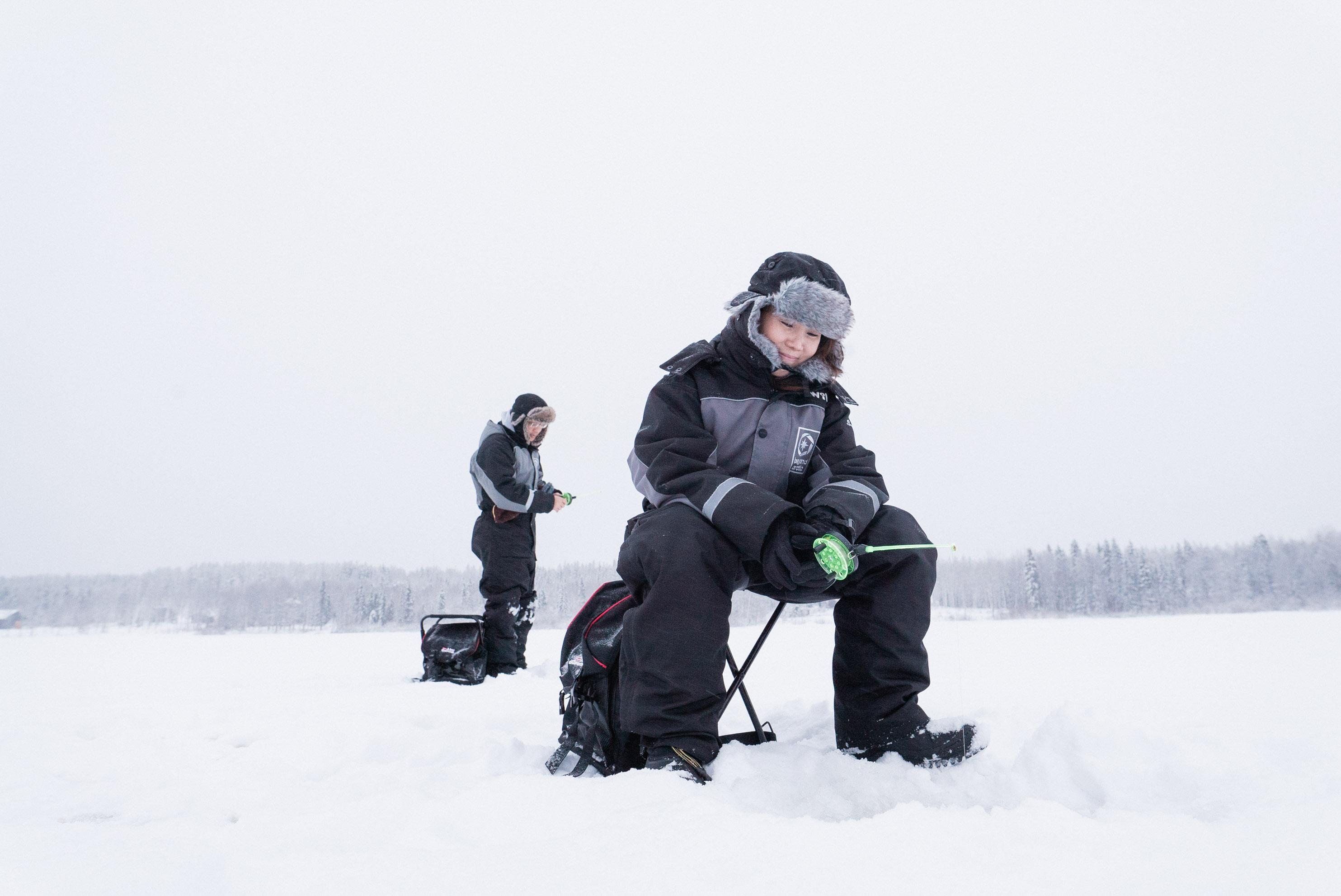 Rovaniemi Ice Fishing on a Frozen Lake with BBQ & Photos