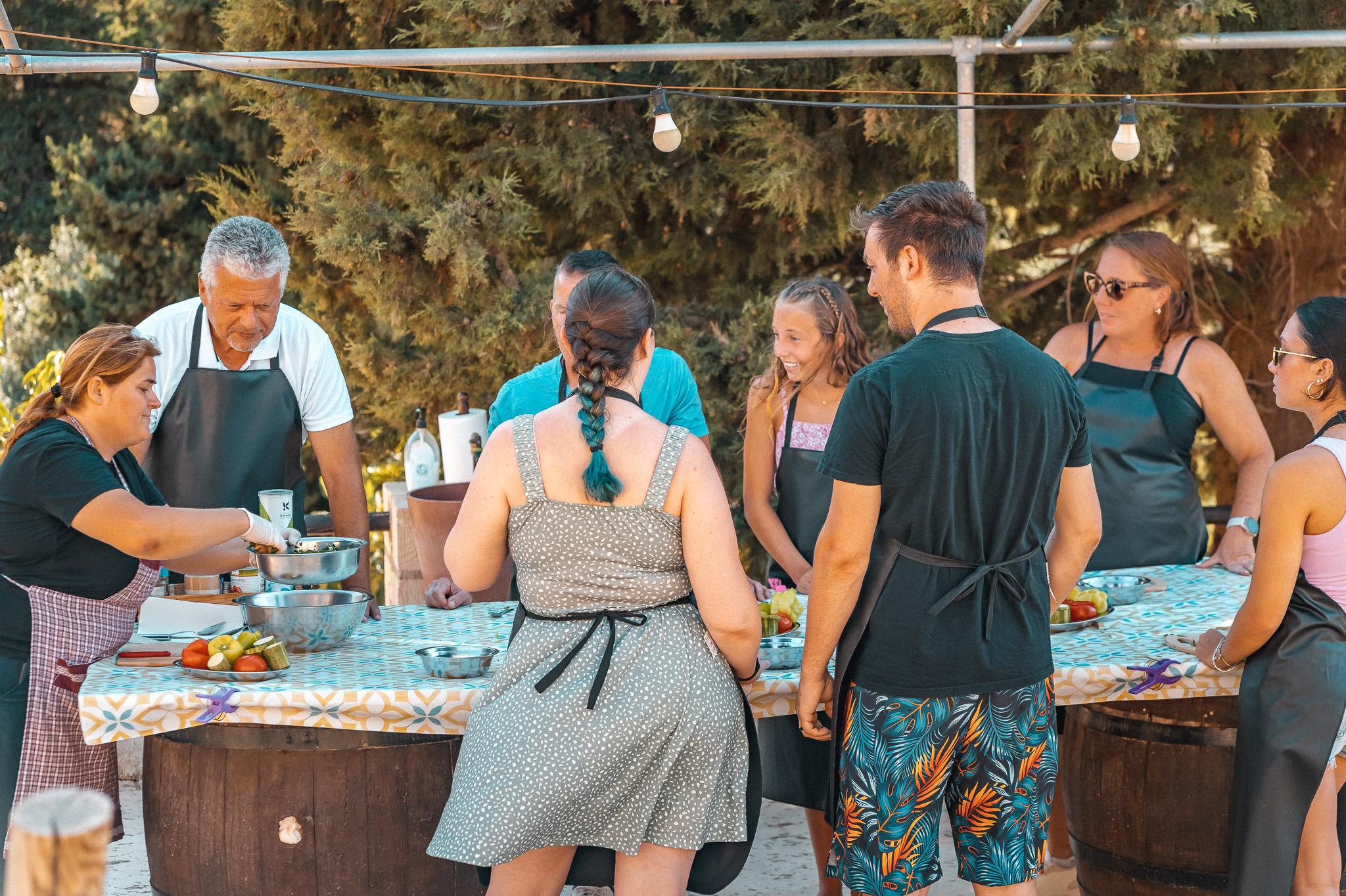 Sharing the meal with local wine after a hands-on Cretan cooking class near Chania