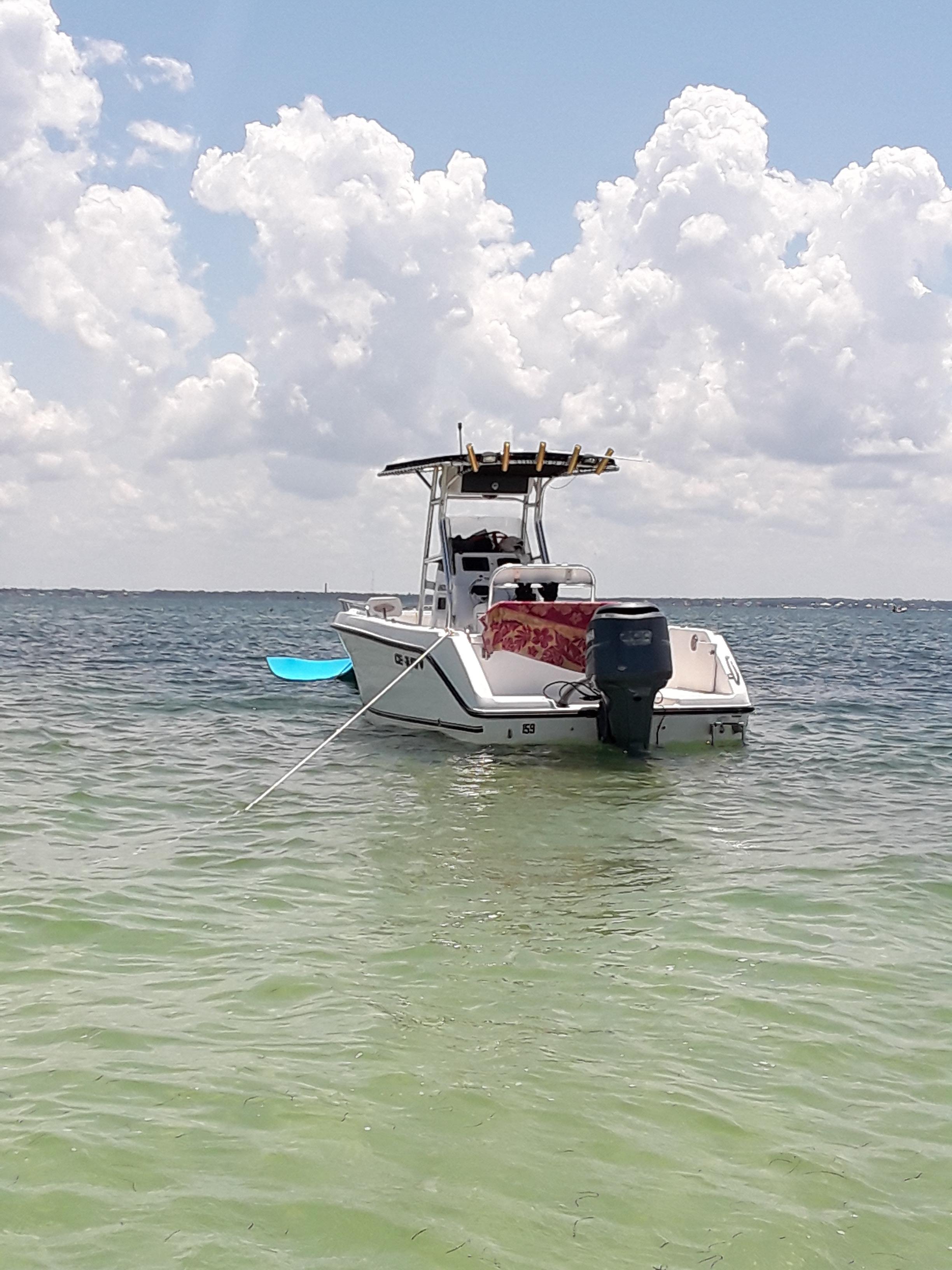 Private Custom Boat Tour, the lead tour returning across calm water