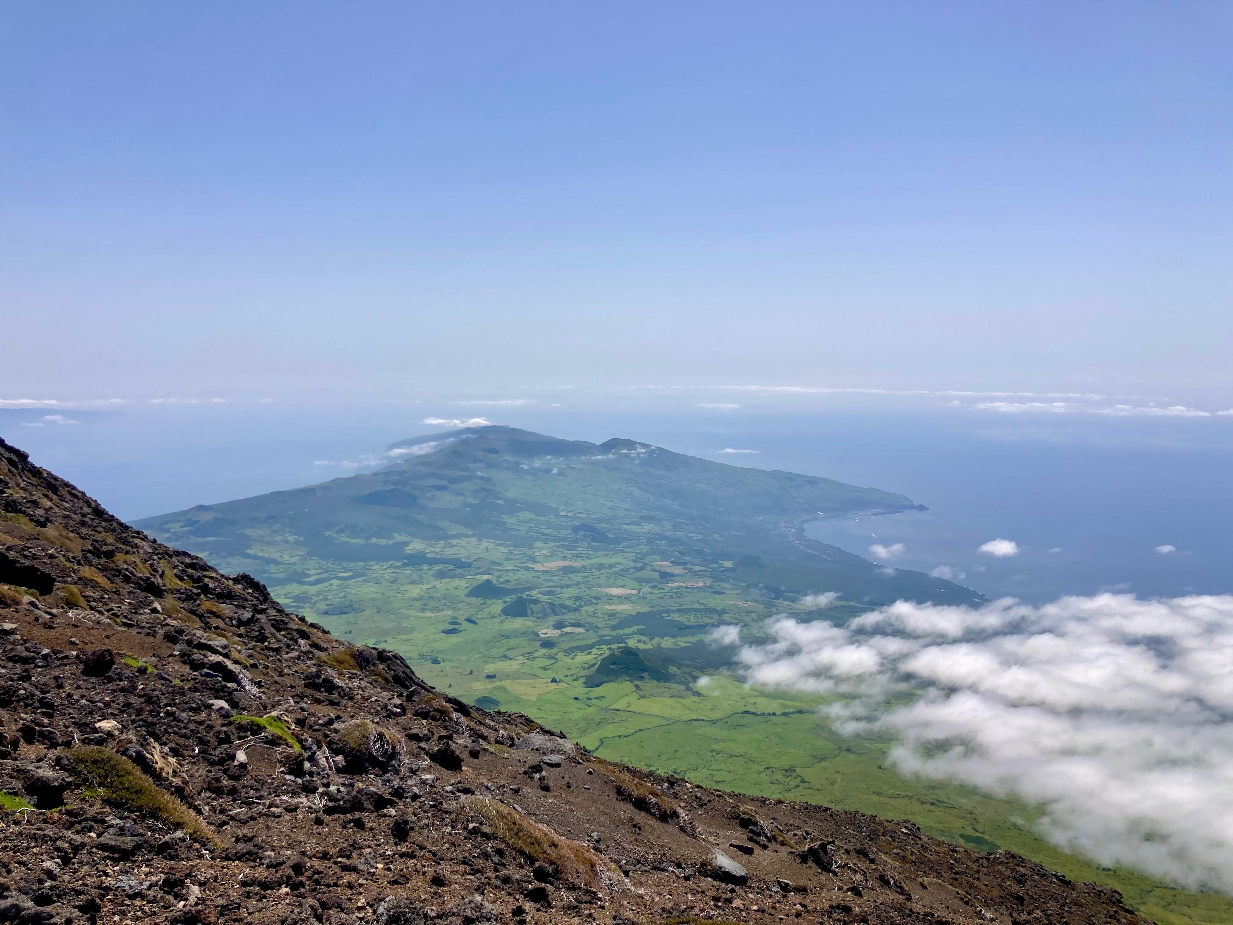 The view down Pico’s slope over the island and low cloud