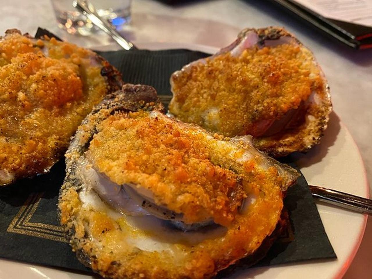 New Orleans food walking tour stopping at a historic French Quarter eatery