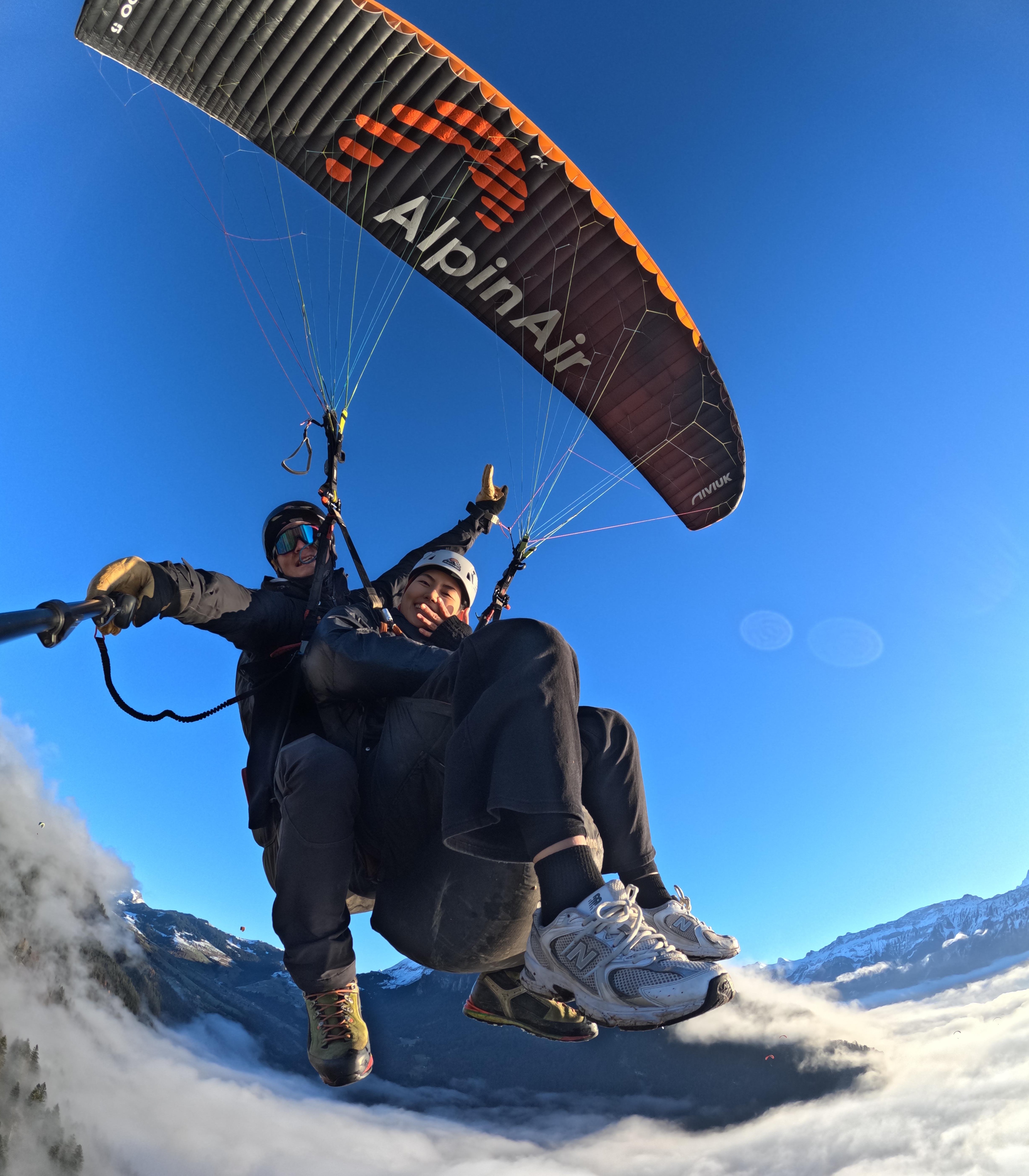 Tandem paragliding over Interlaken Bernese Oberland Switzerland alpine lakes — image 2