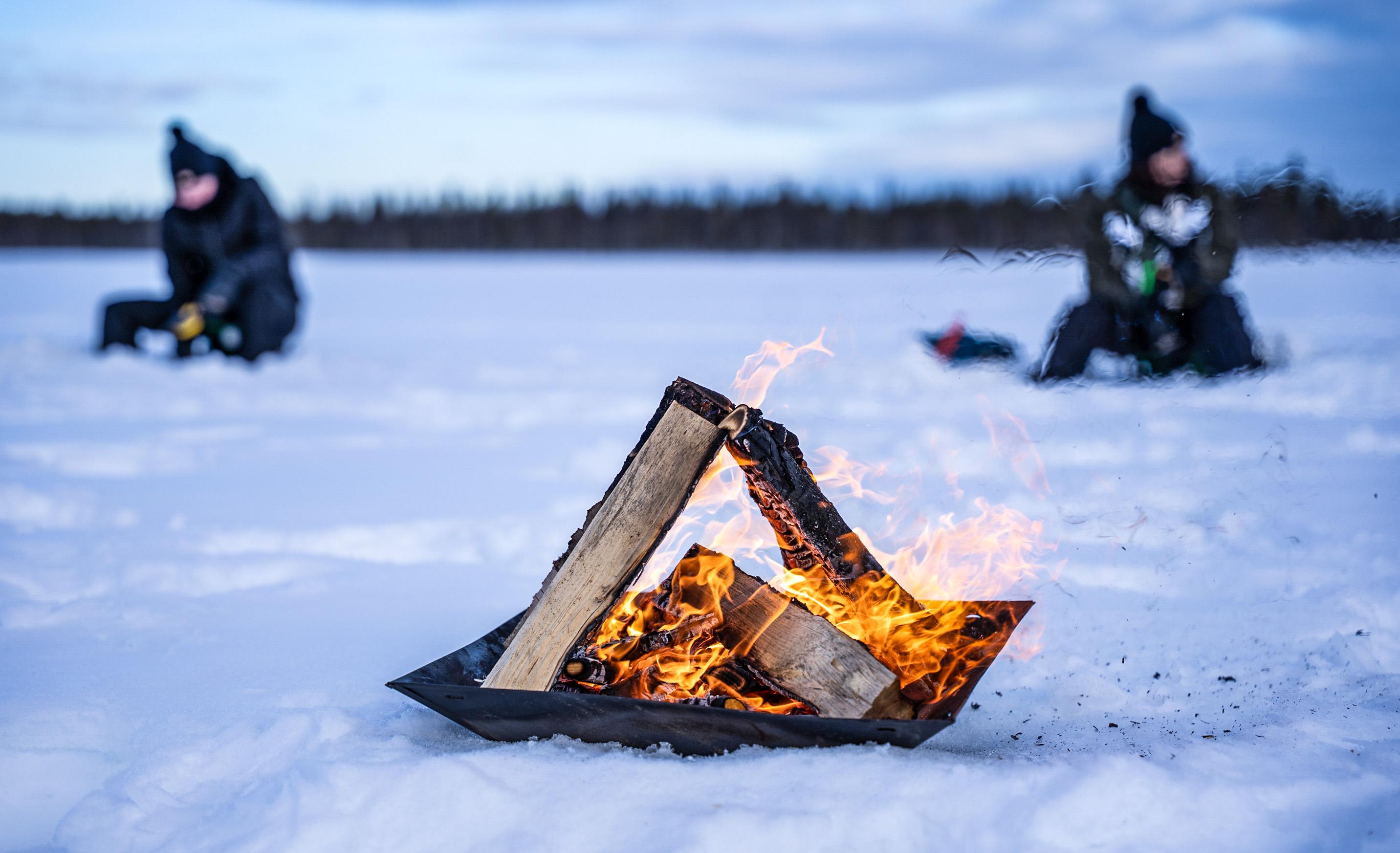 Rovaniemi Ice Fishing on a Frozen Lake with BBQ & Photos