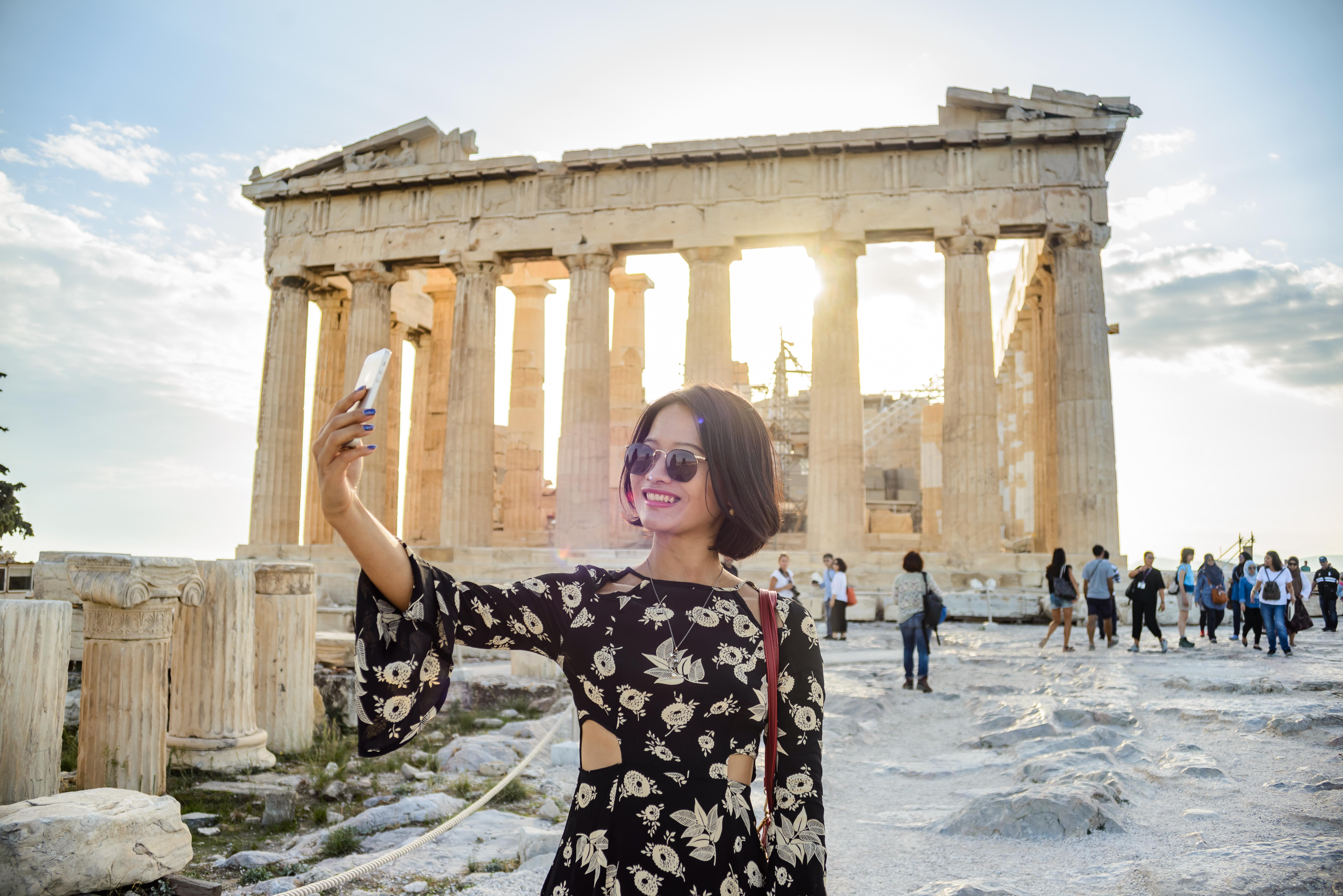 Marble columns of the Parthenon with a licensed guide leading an Acropolis tour in Athens