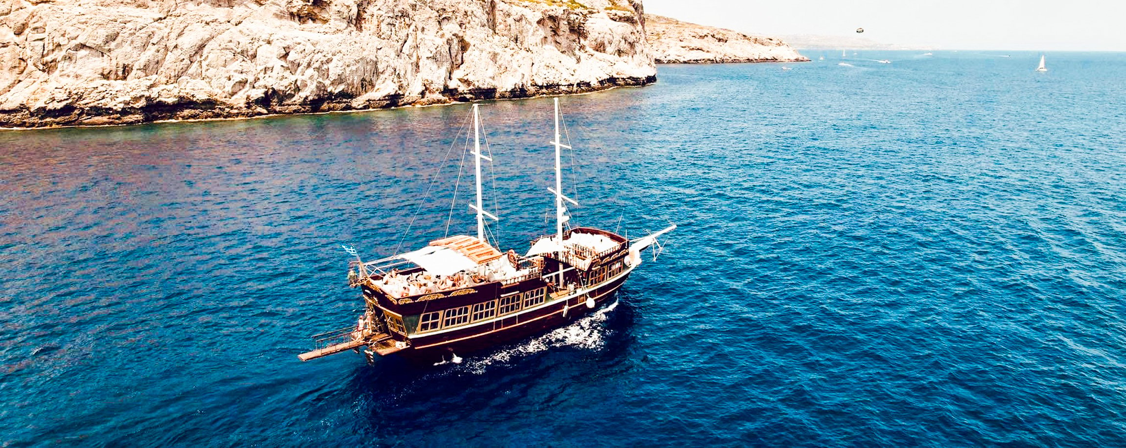 Rhodes Sunset Cruise with Greek BBQ & Unlimited Drinks