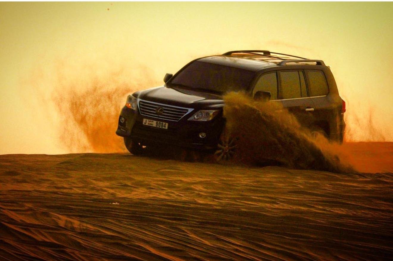 Doha Desert Safari: Sunset Dune Bashing, Camel Ride & Sandboarding