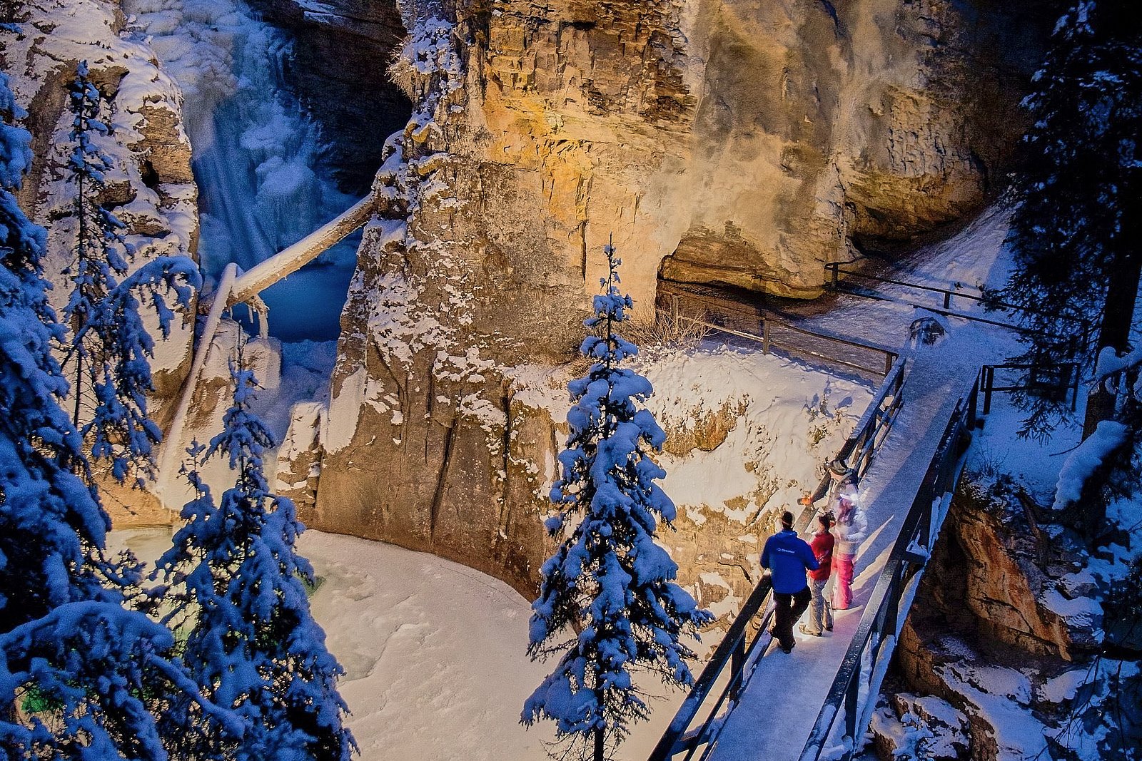 Johnston Canyon evening icewalk — headlamp-lit Lower Falls after dark, Banff