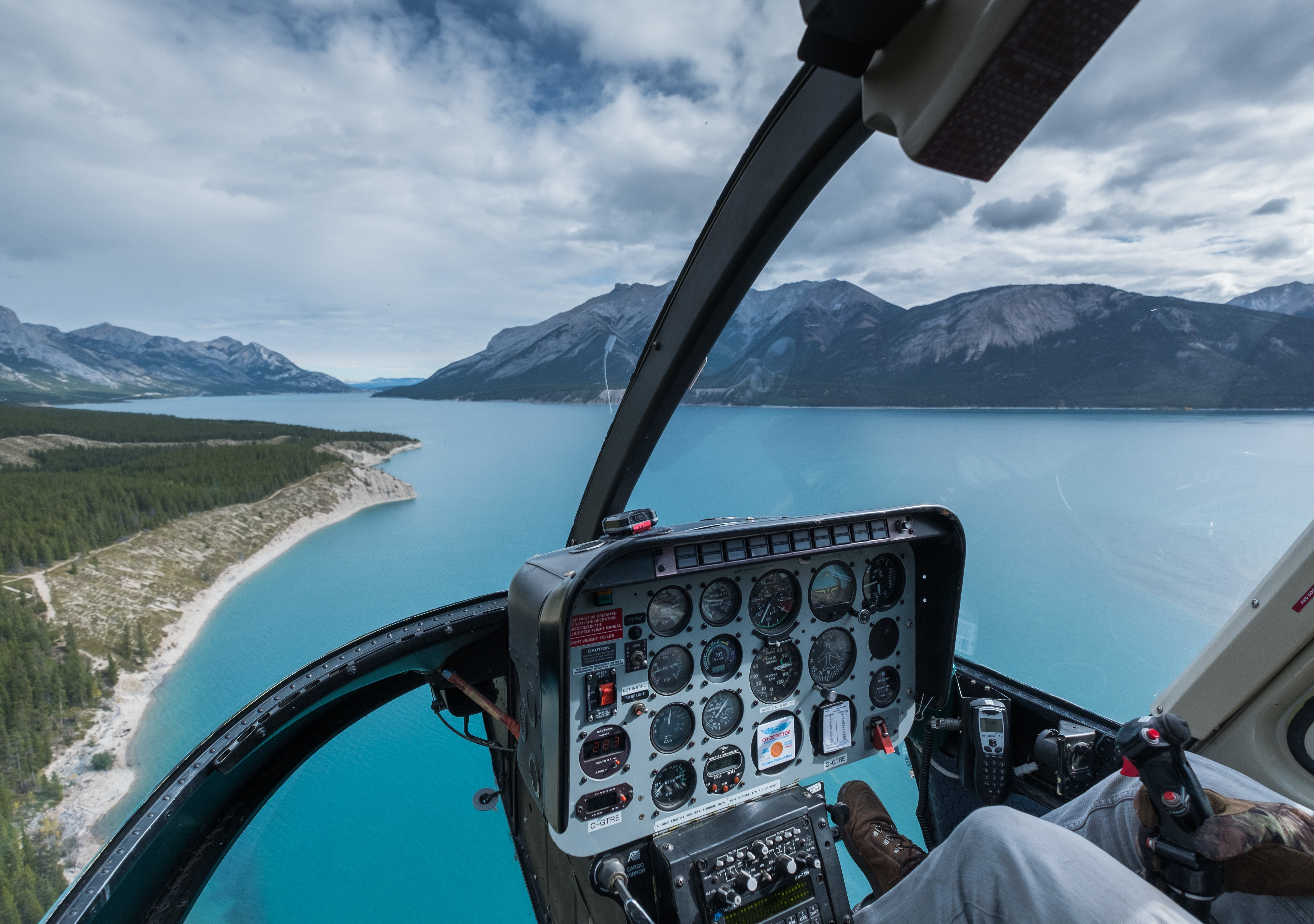 Canadian Rockies helicopter flight landing for a guided hike to Twin Falls