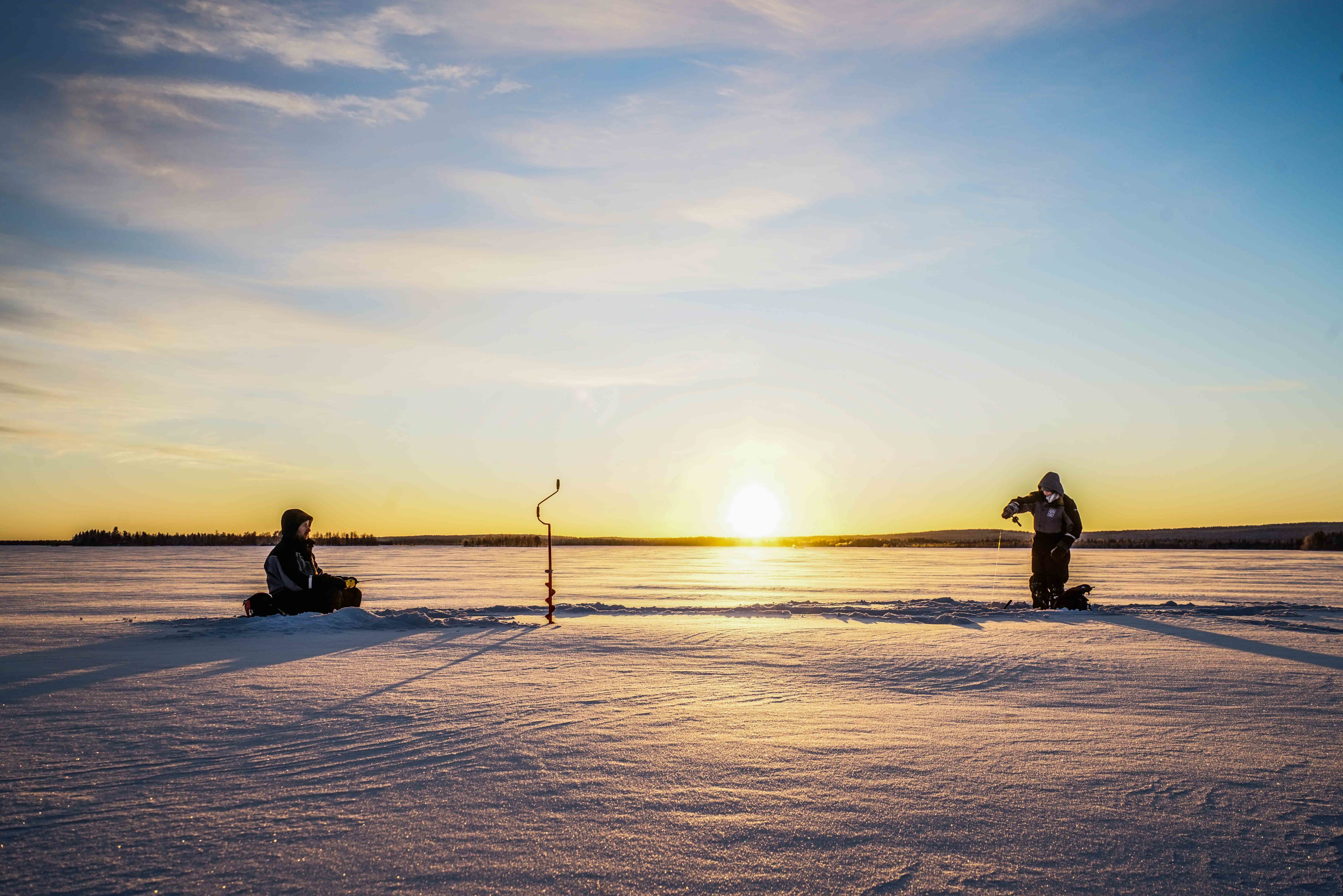 Rovaniemi Ice Fishing on a Frozen Lake with BBQ & Photos