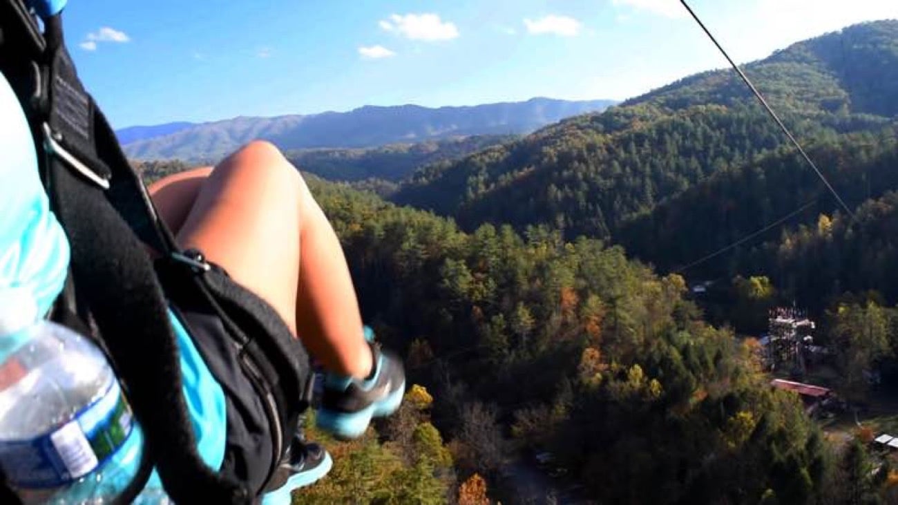 Zip liner flying the longest line on a Pigeon Forge zipline tour