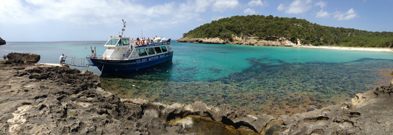 Boat to Cala Macarella — the turquoise cala and cliffs from the water — image 3
