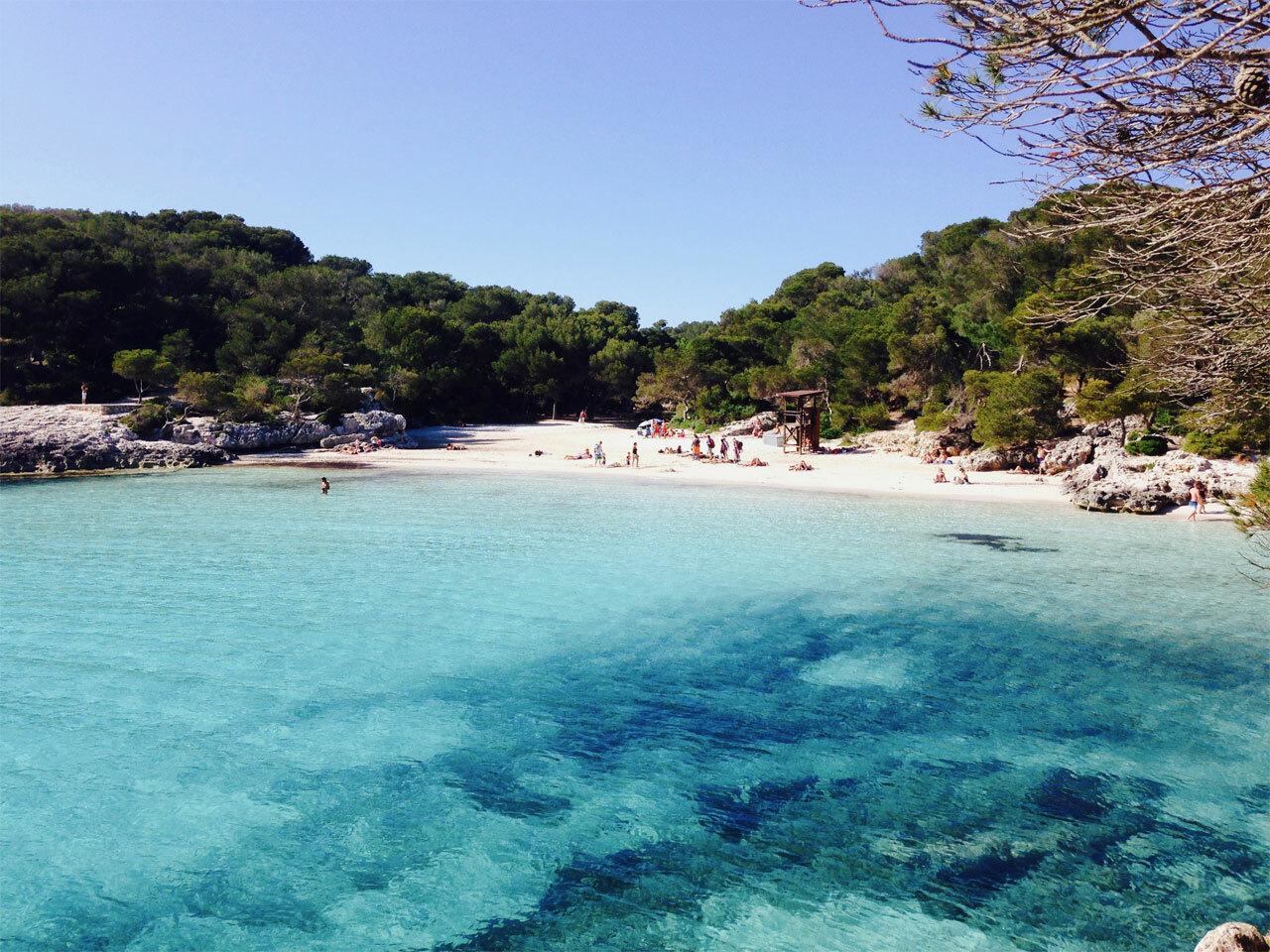 Boat to Cala Macarella — the turquoise cala and cliffs from the water — image 1