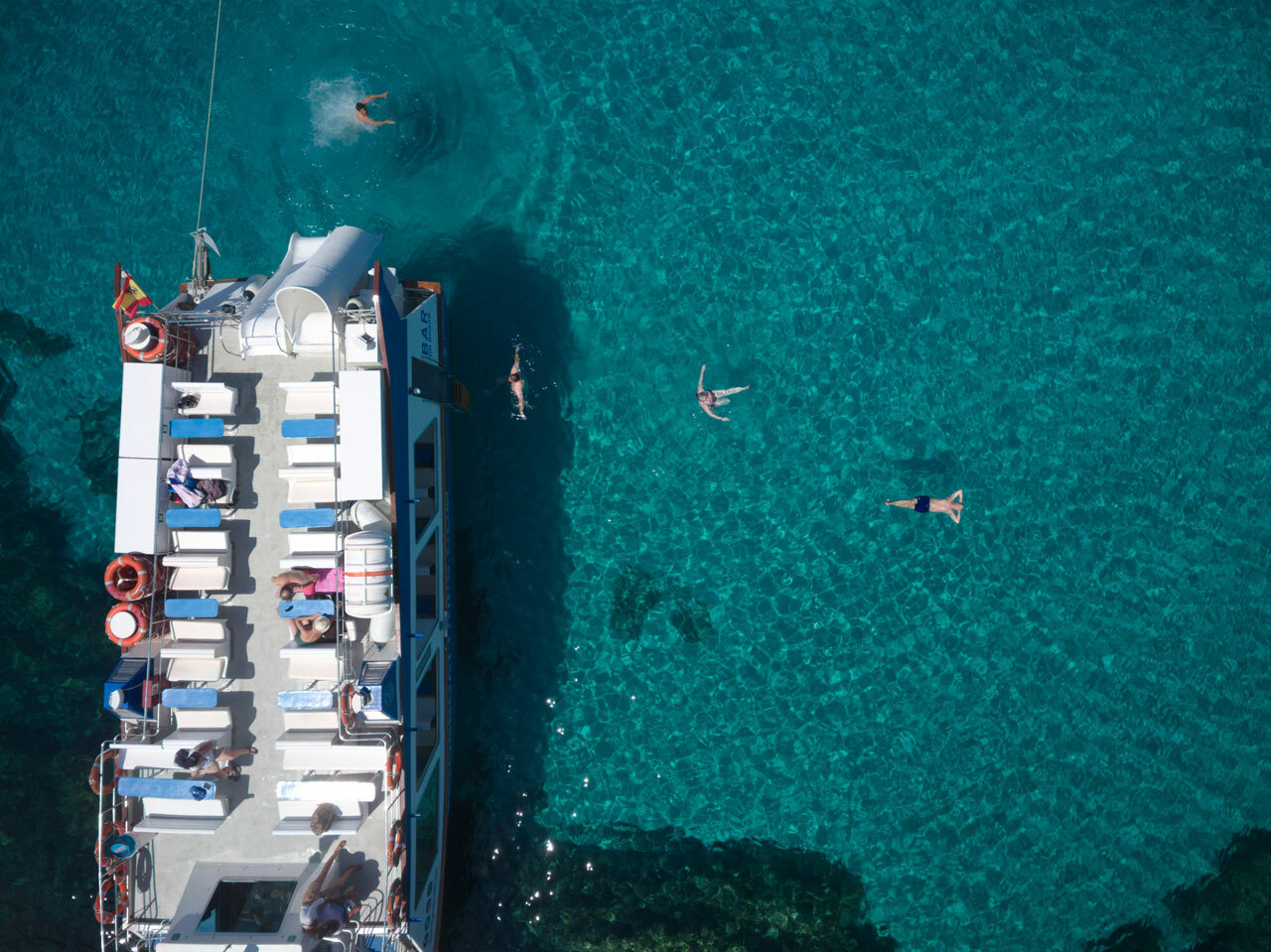 Boat to Cala Macarella — the turquoise cala and cliffs from the water — image 2