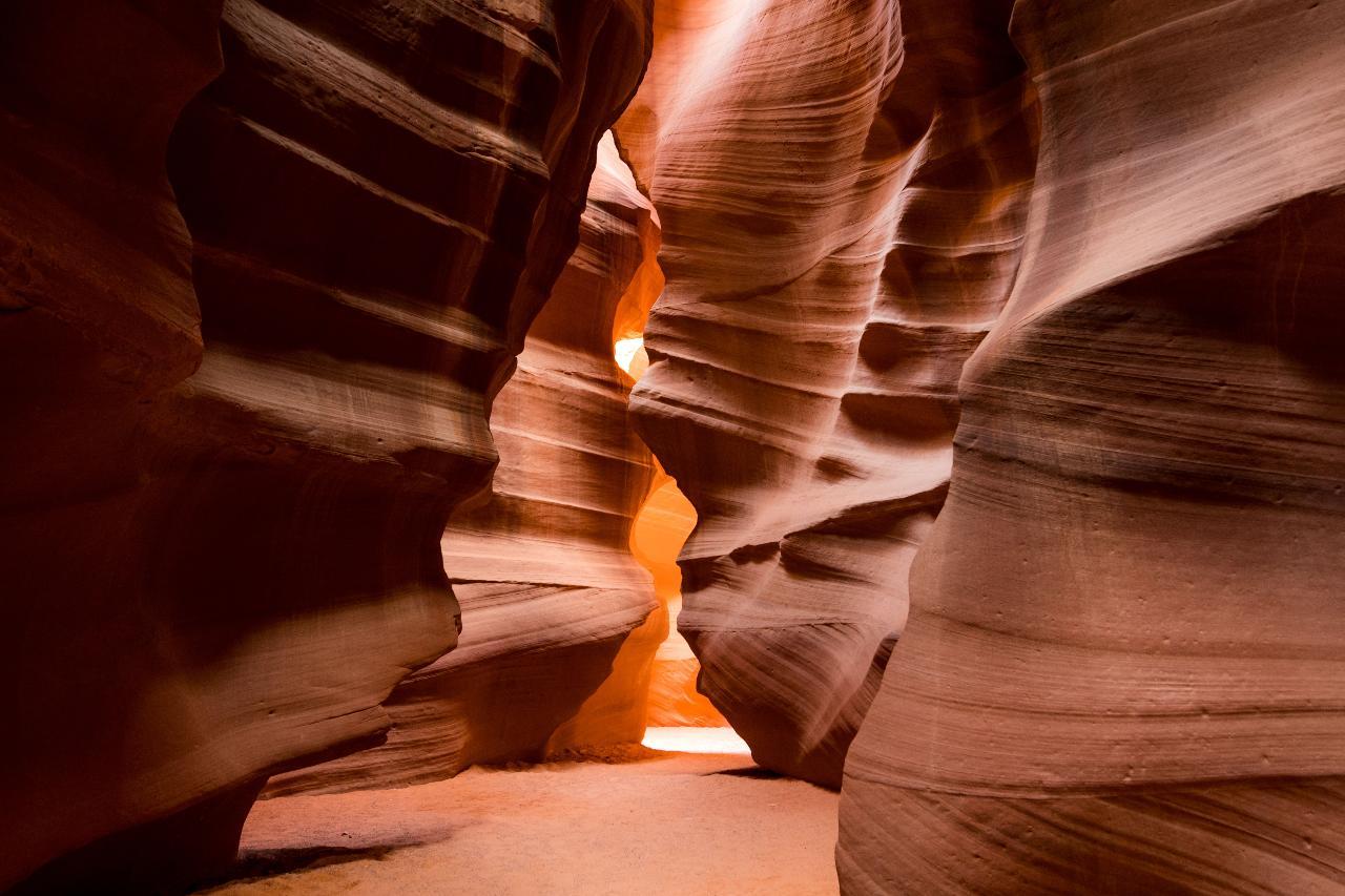 Upper Antelope Canyon light beams and sandstone walls — image 1