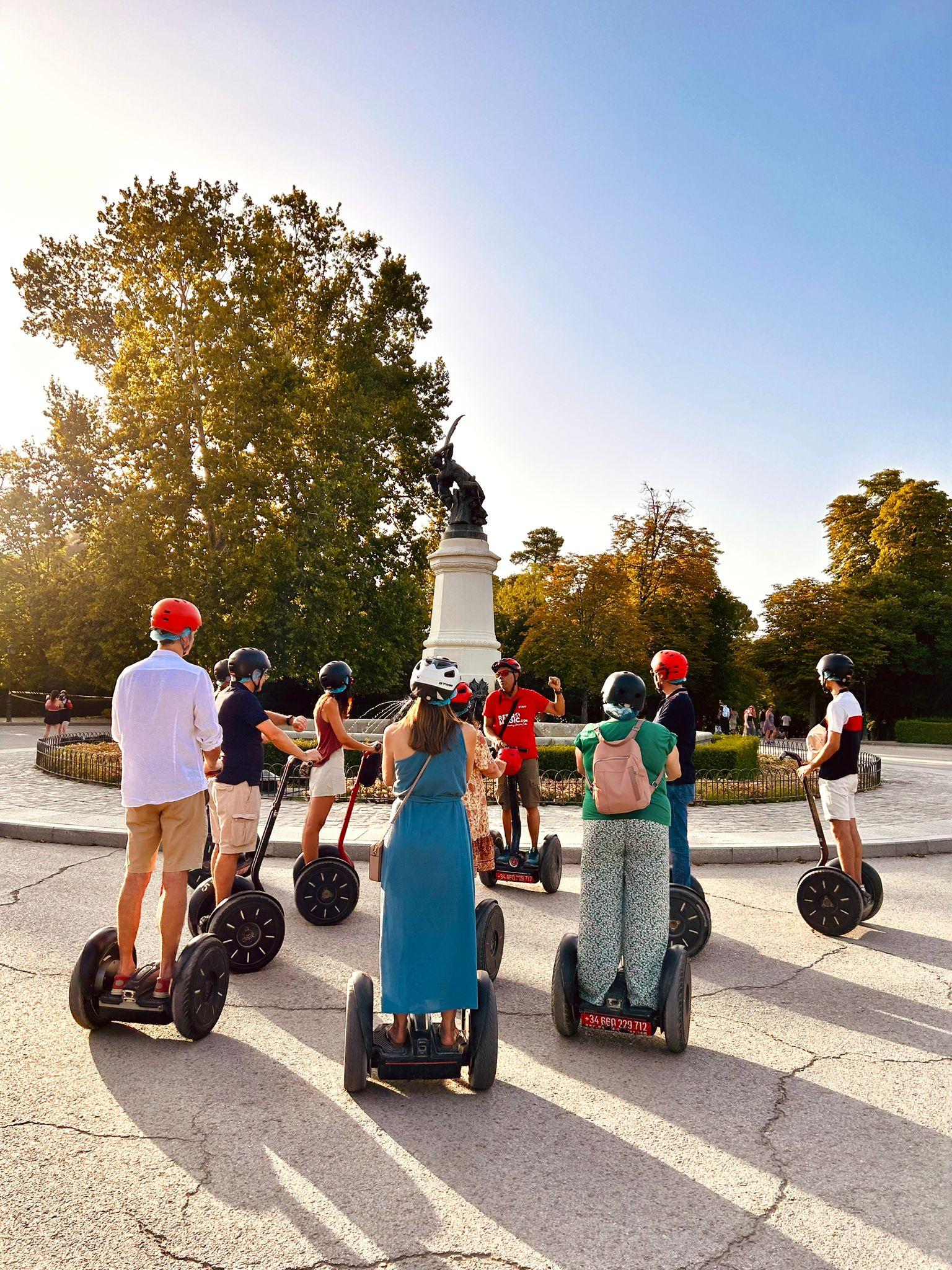 Iconic Retiro Park segway tour — group passing the monument to Alfonso XII and the Estanque boating lake