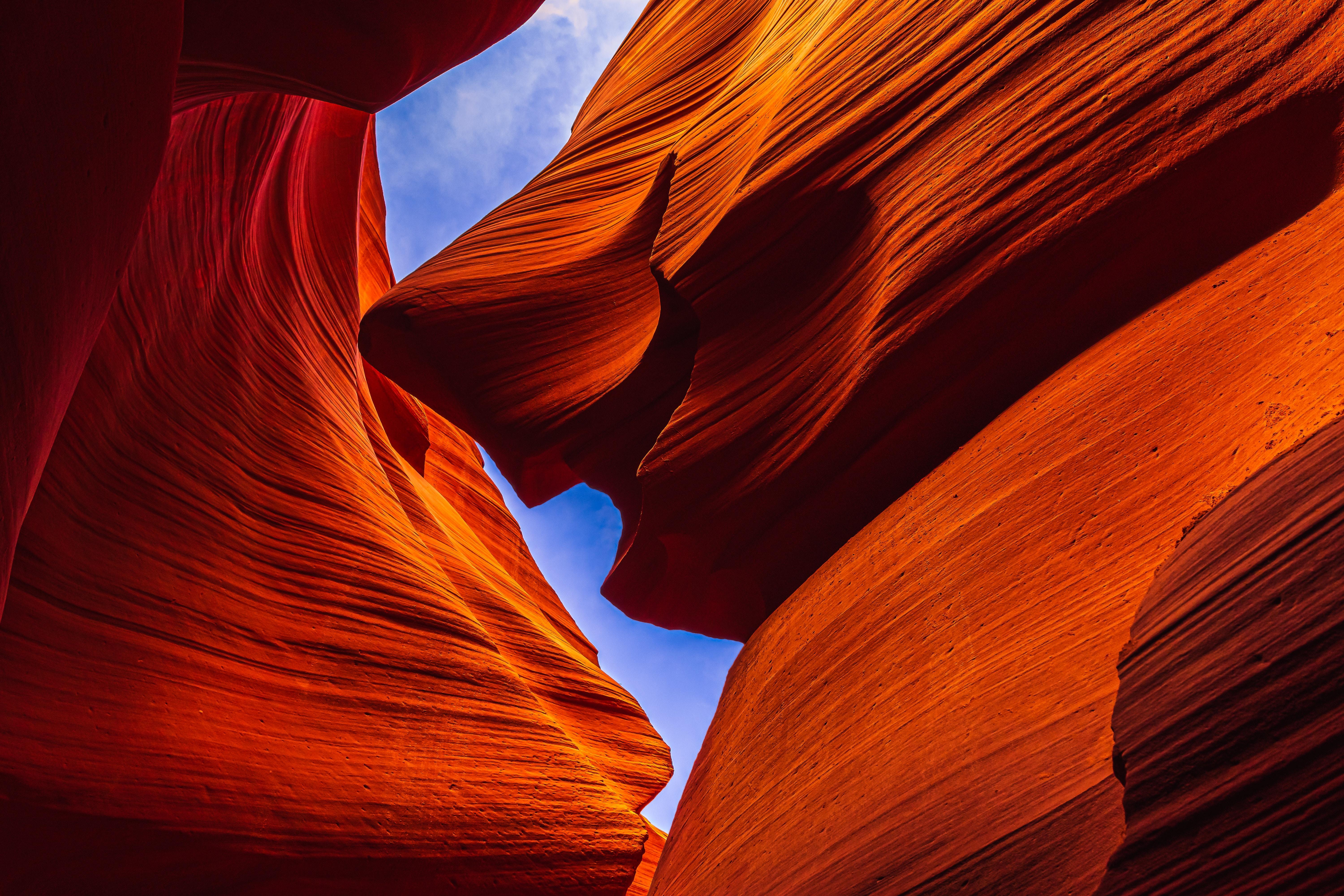 Descending the metal stairs into Lower Antelope Canyon's narrow slot with a Navajo guide