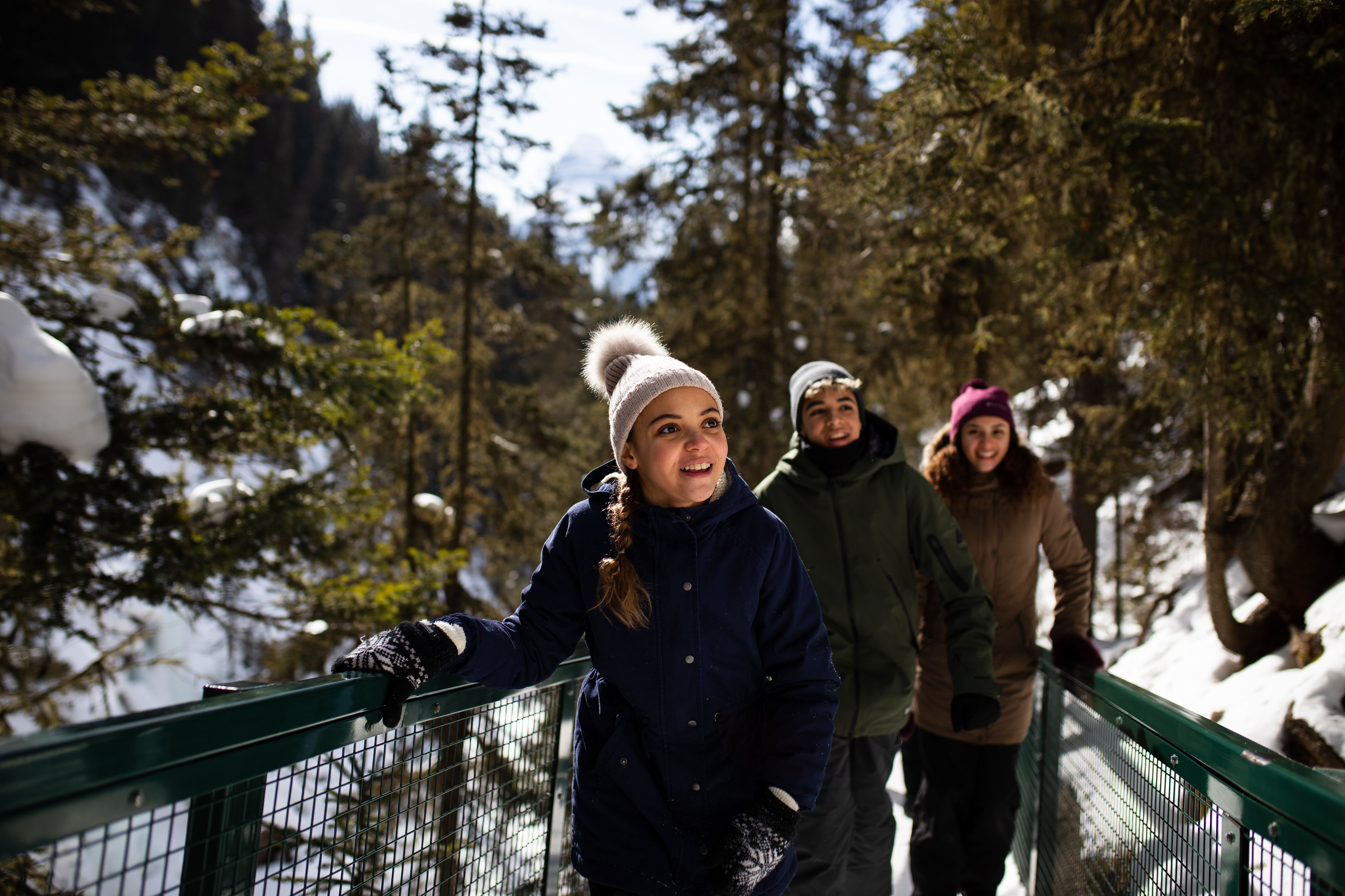 Johnston Canyon frozen falls guided adventure — ice cleats on the canyon catwalks