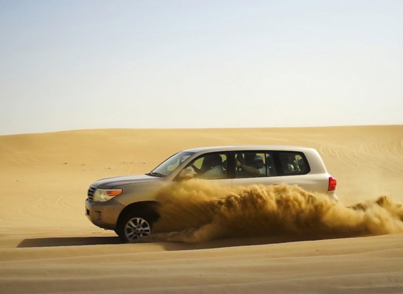 Doha Desert Safari: Sunset Dune Bashing, Camel Ride & Sandboarding