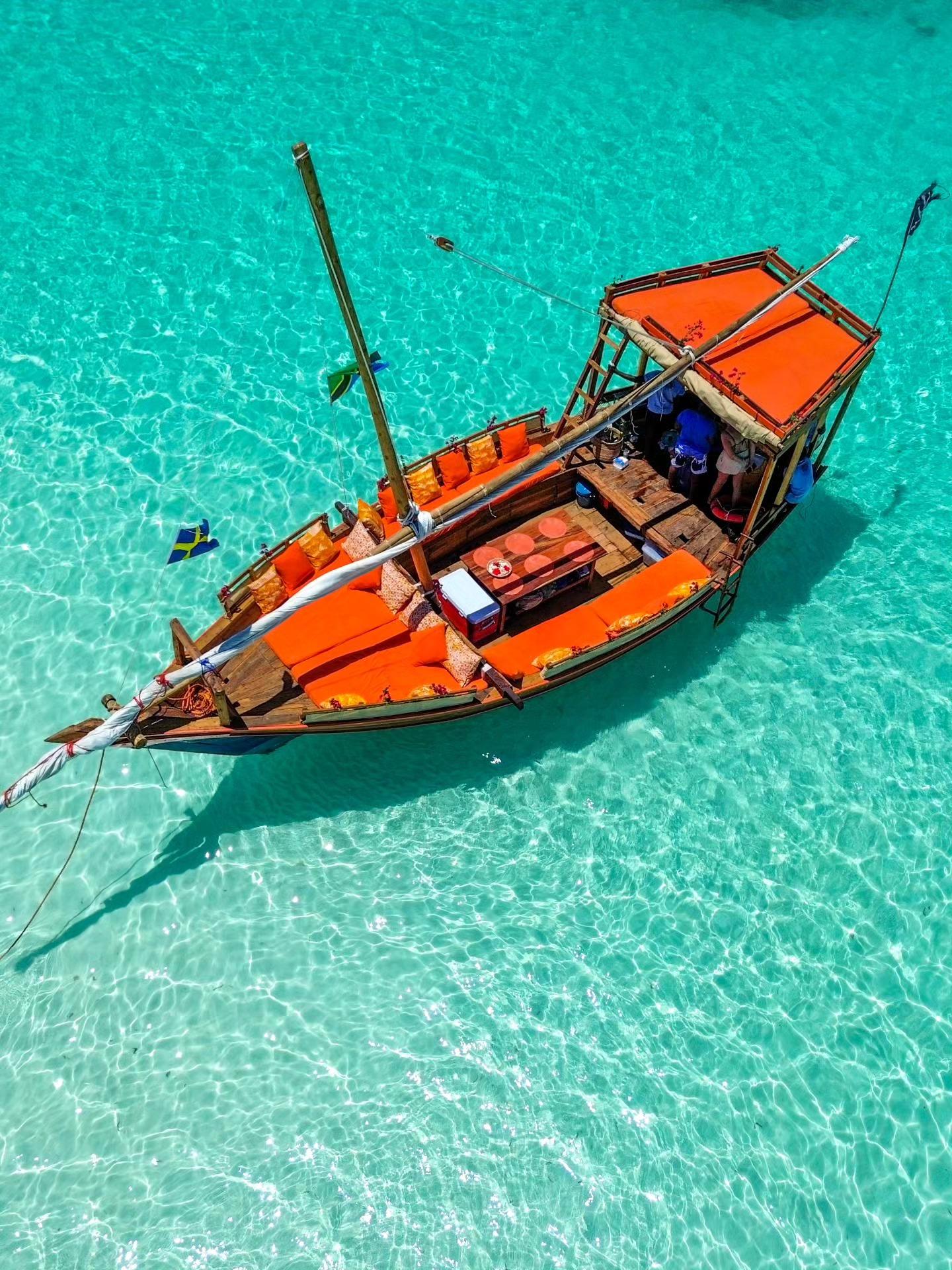 Mnemba Island Full-Day Dhow Sail: Dolphins, Snorkeling & BBQ