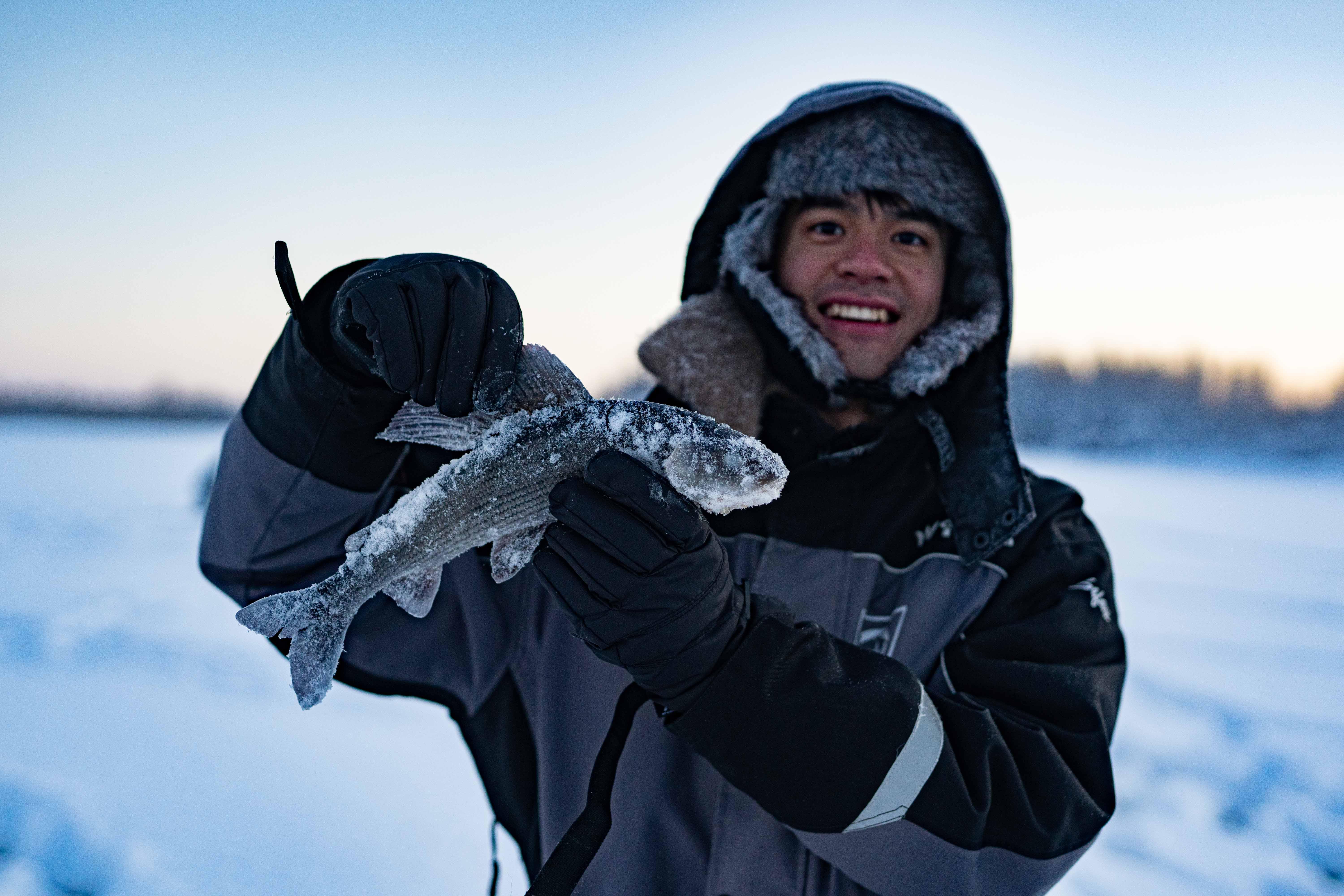 Rovaniemi Ice Fishing on a Frozen Lake with BBQ & Photos