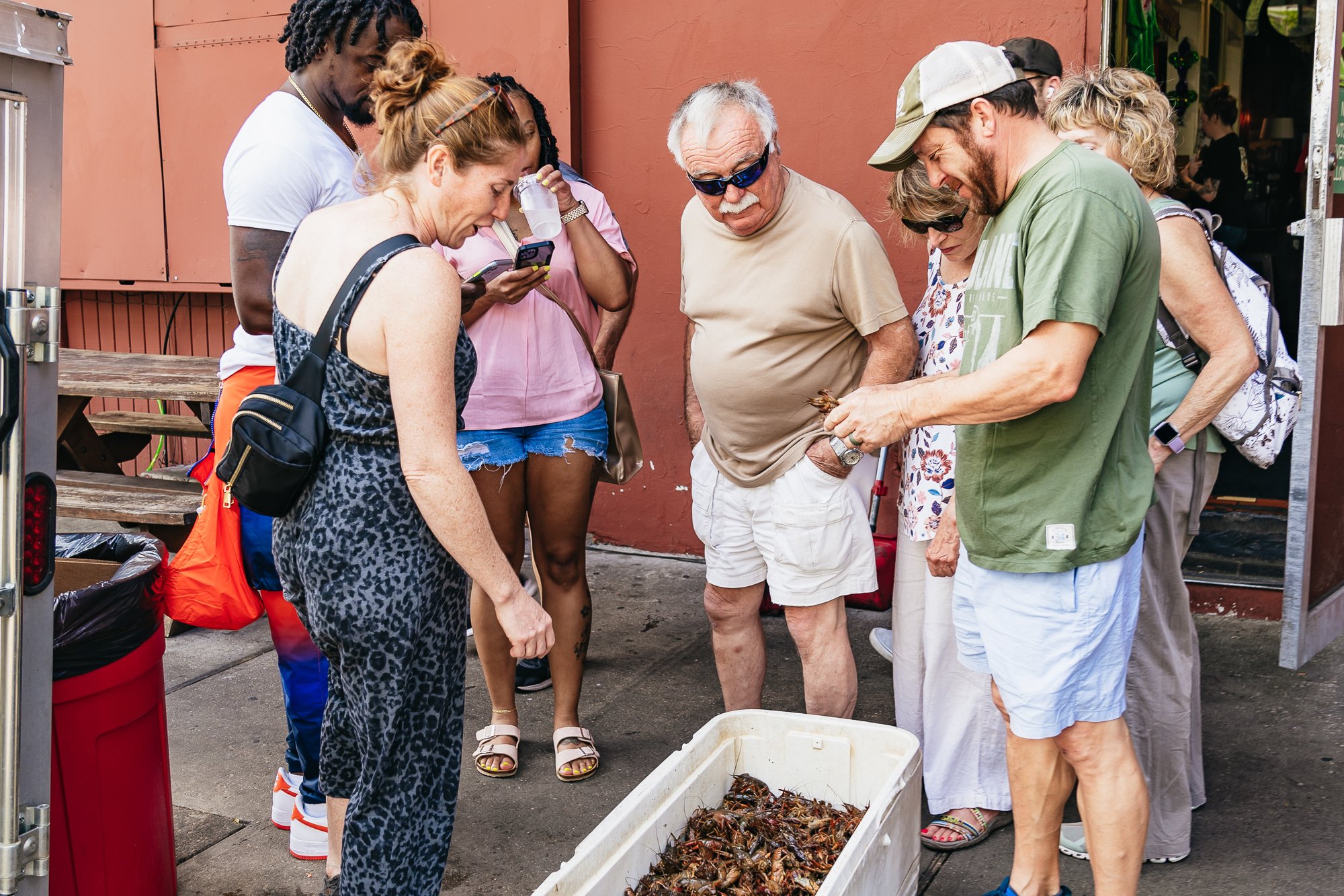 Garden District food, drinks and history tour walking past New Orleans architecture