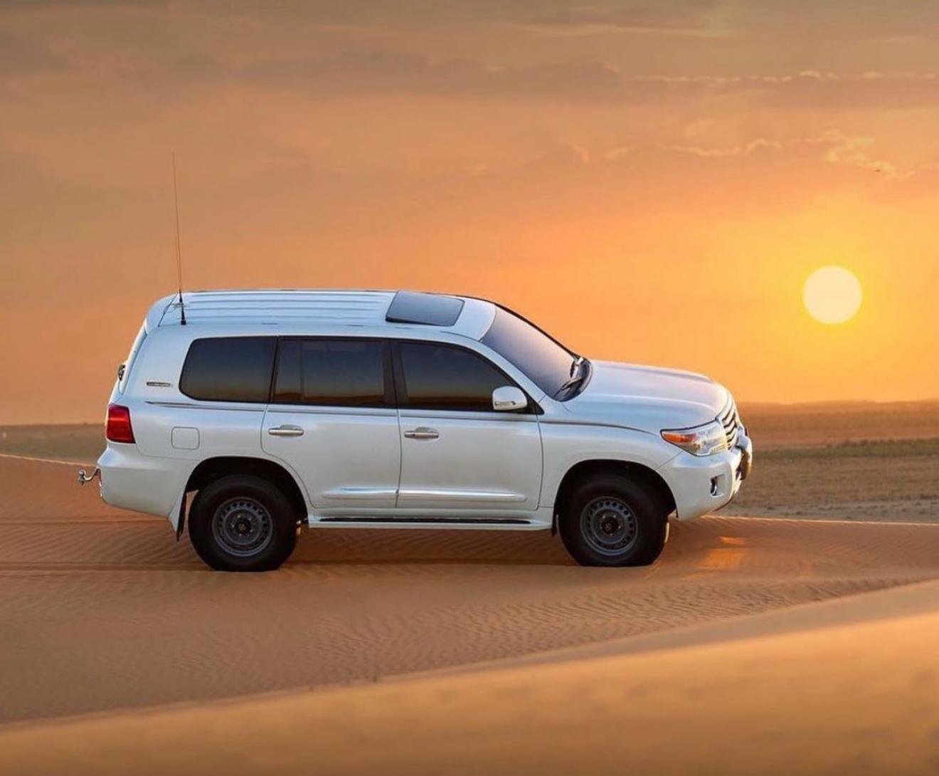 Doha Desert Safari: Sunset Dune Bashing, Camel Ride & Sandboarding