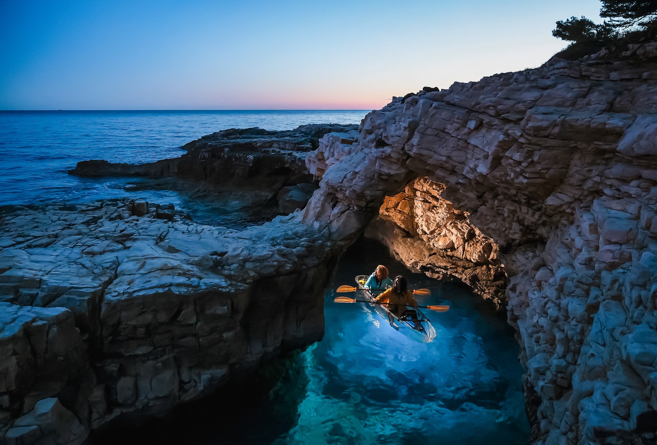 Pula: Transparent Kayak Sunset & Night Glow Tour