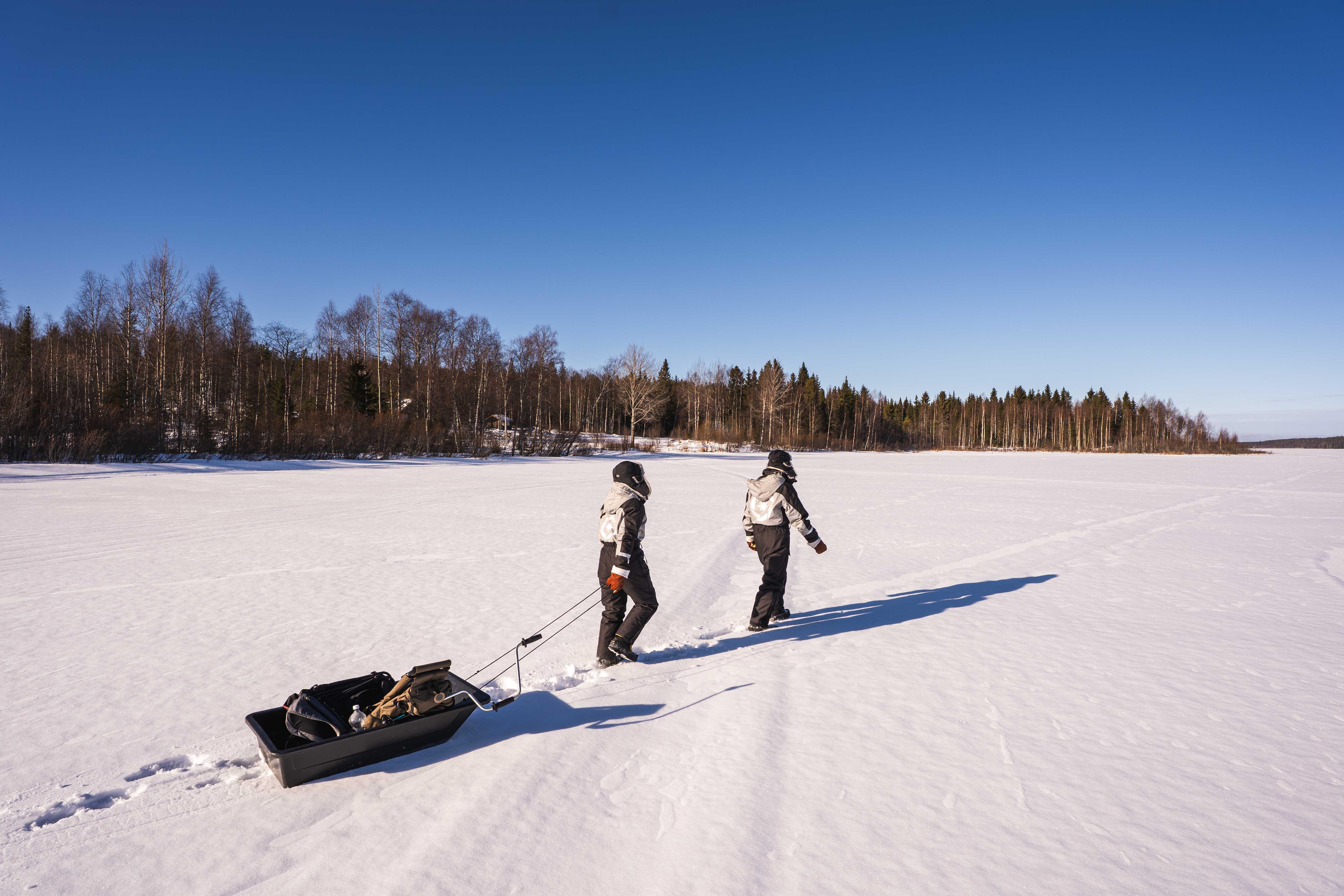 Rovaniemi Ice Fishing on a Frozen Lake with BBQ & Photos