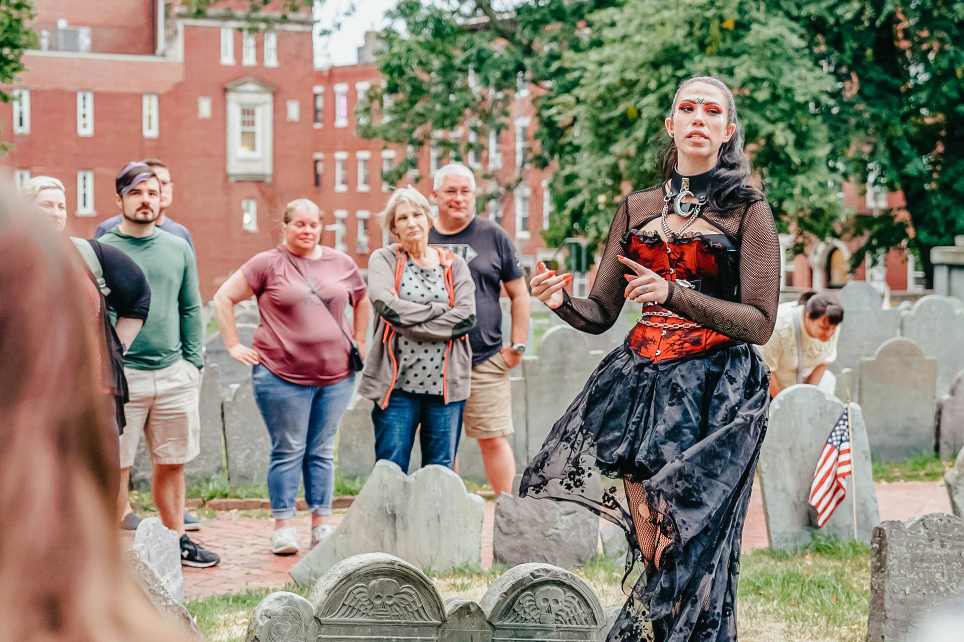 Boston ghosts and gravestones tour guide in character at historic cemetery, haunted walking tour Boston