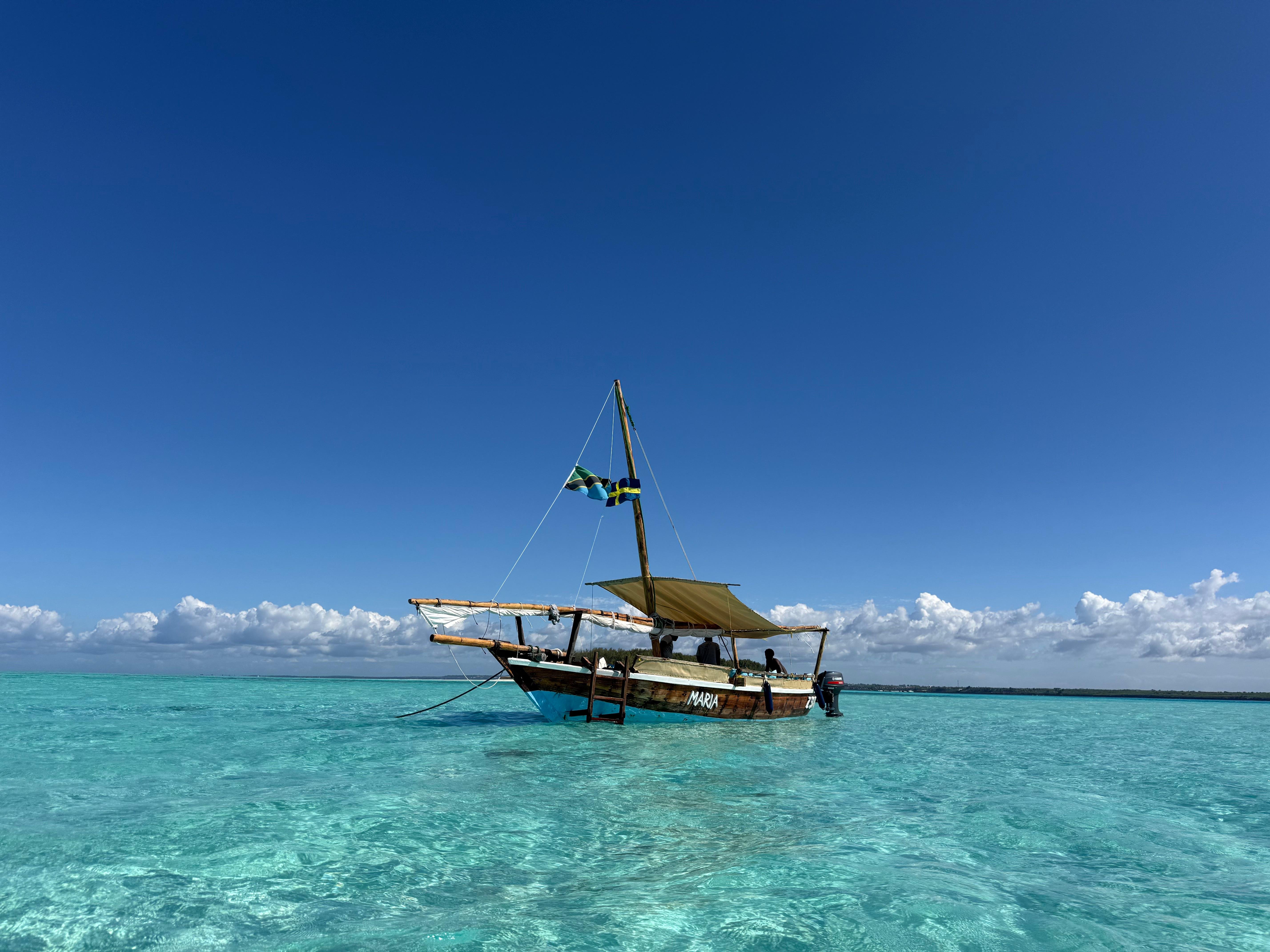 Mnemba Island Dhow Cruise with Snorkeling & Seafood BBQ