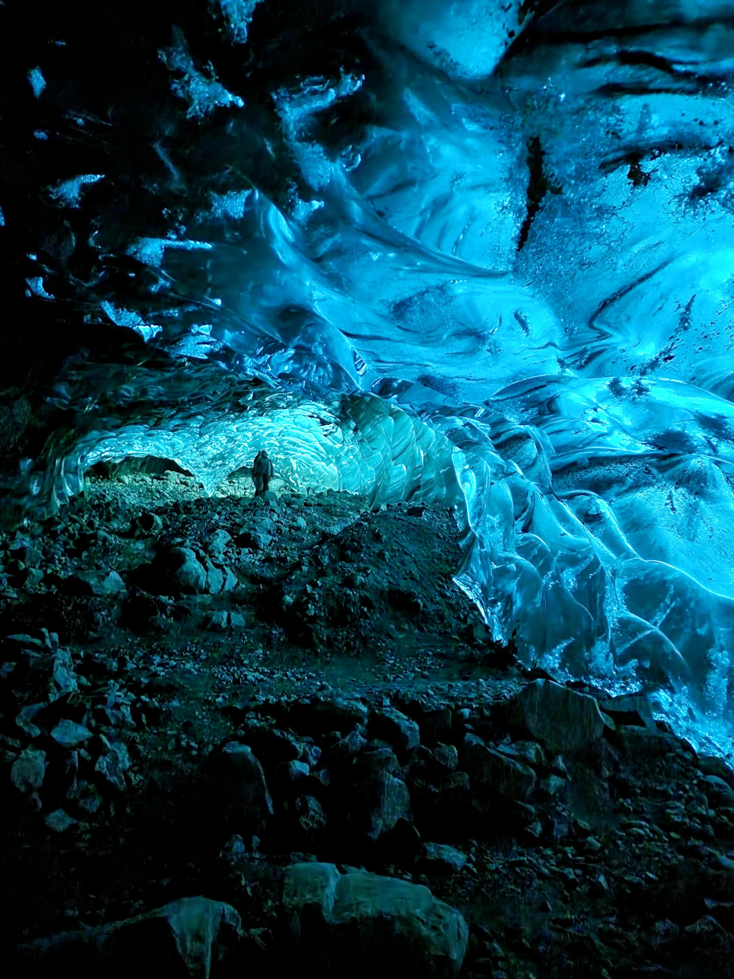 Compressed glacial ice glowing blue inside a Vatnajökull ice cave