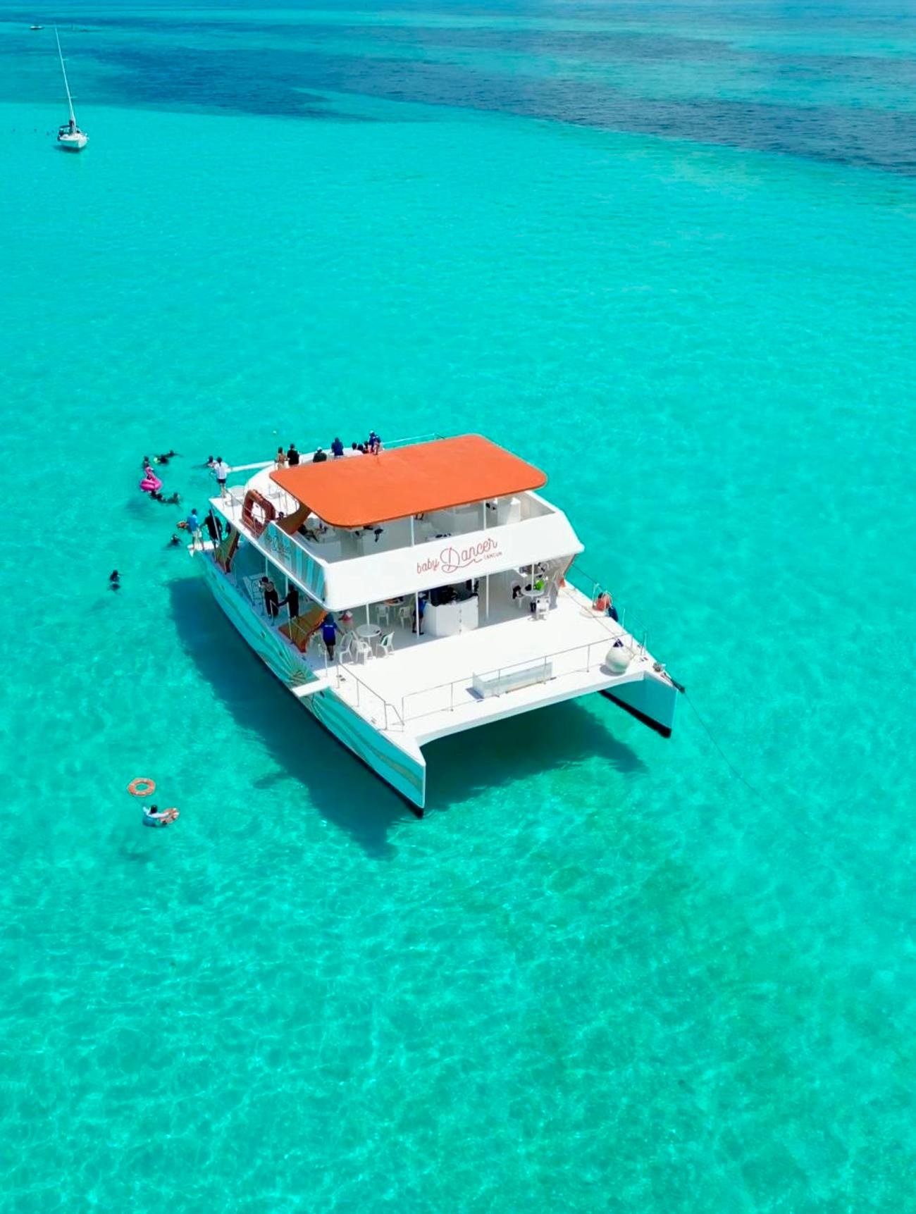 Isla Mujeres Party Catamaran with Snorkeling & Beach Time