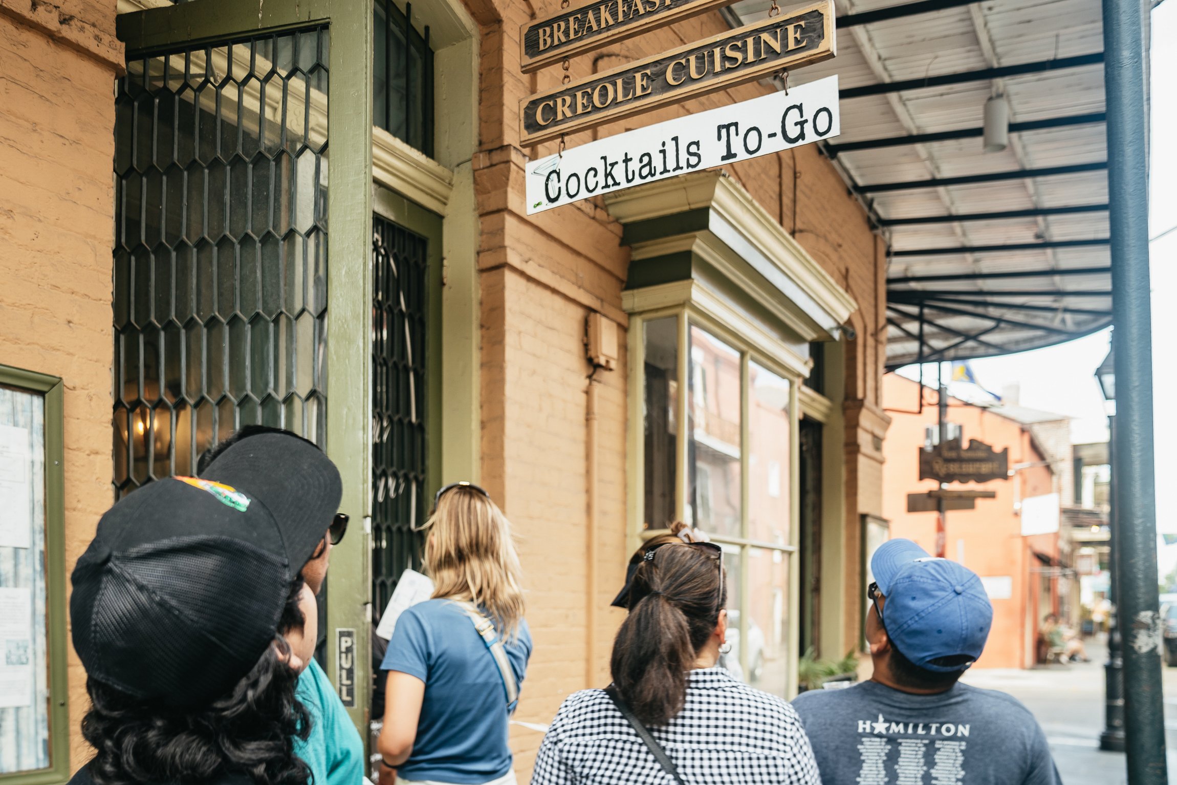 Small-group French Quarter food tour gathered at a tasting stop